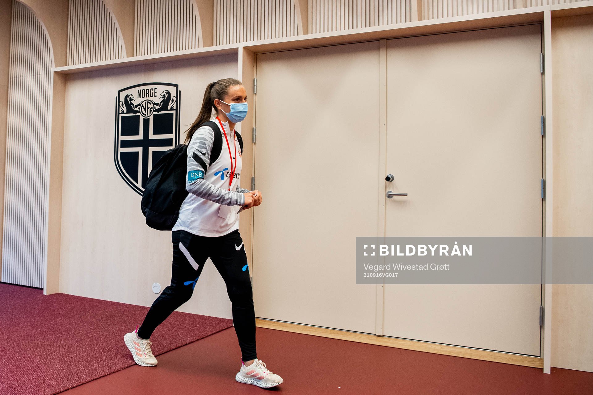 Vilde Bøe Risa of Norway arrives wearing a face mask