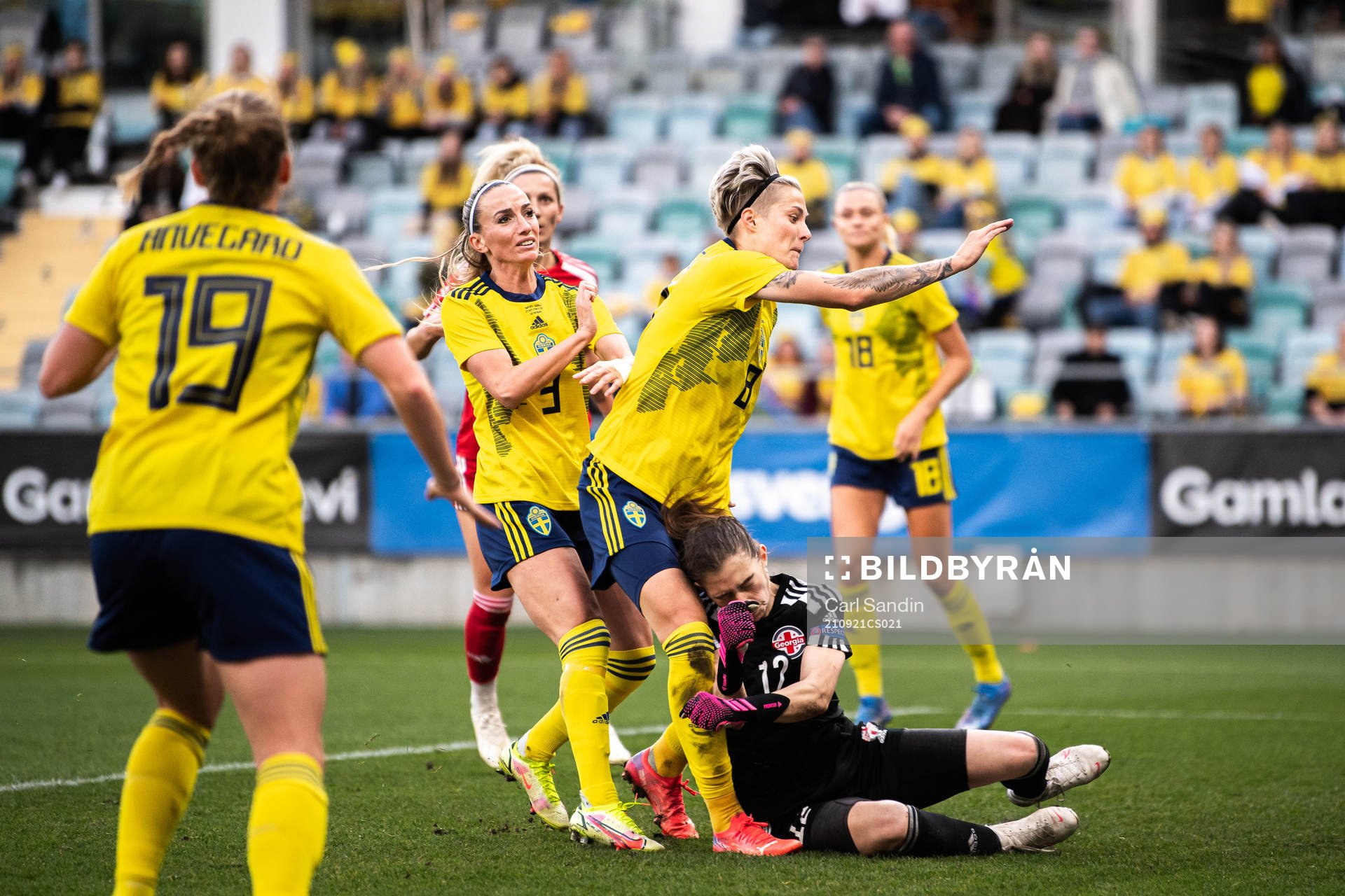 Lina Hurtig of Sweden collides with goalkeeper Tatia abunia