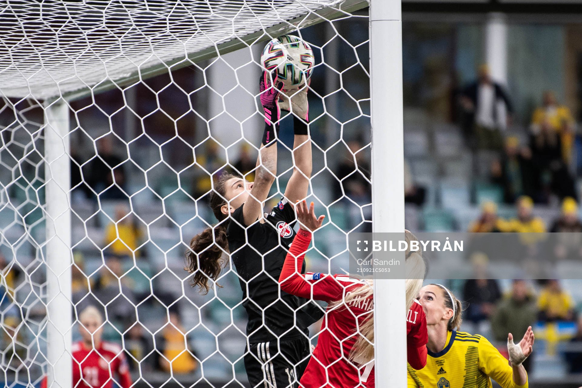 Goalkeeper Tatia abunia of Georgia with a save in front of