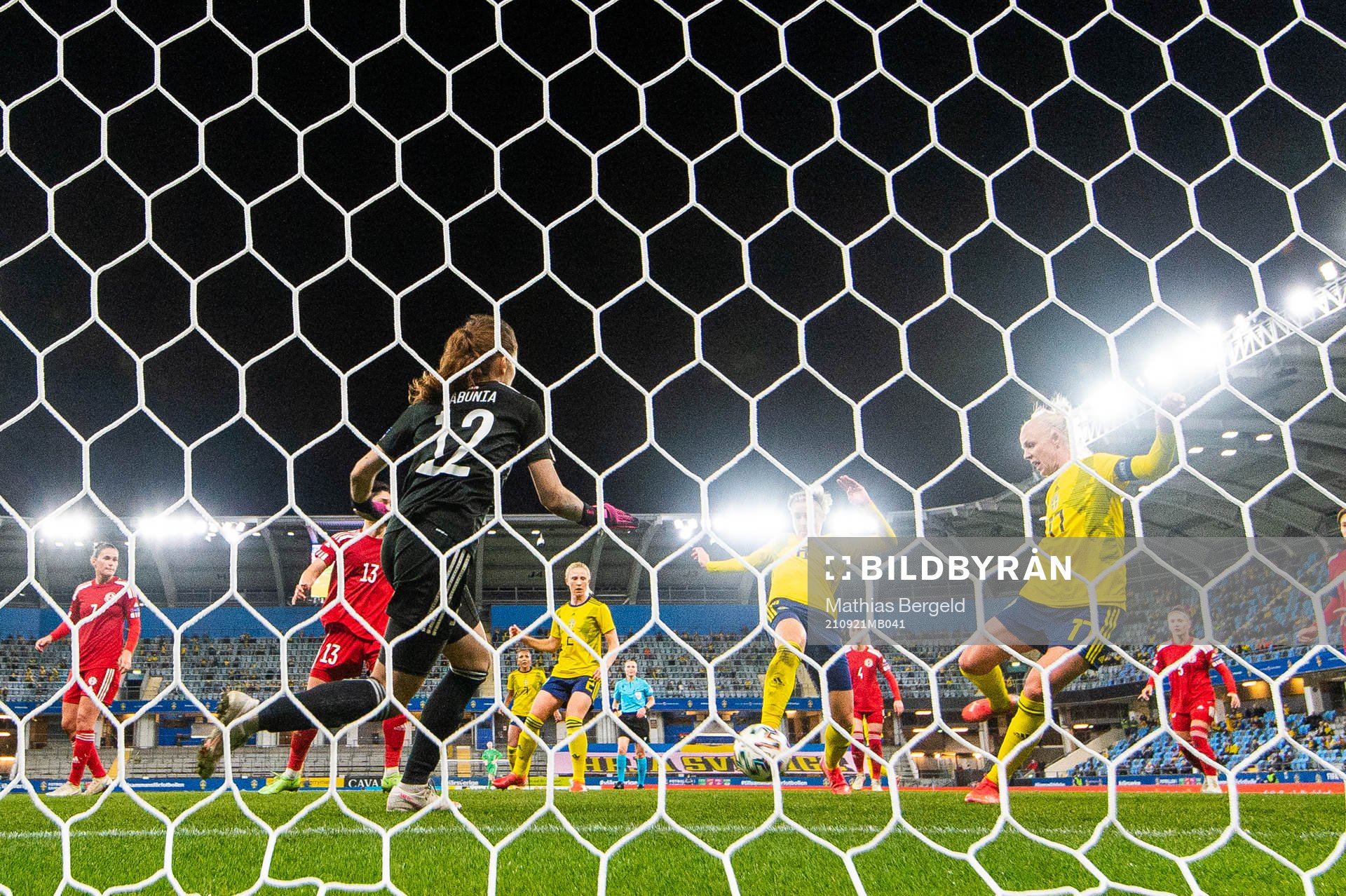 Caroline Seger of Sweden scores 4-0 behind goalkeeper Tatia