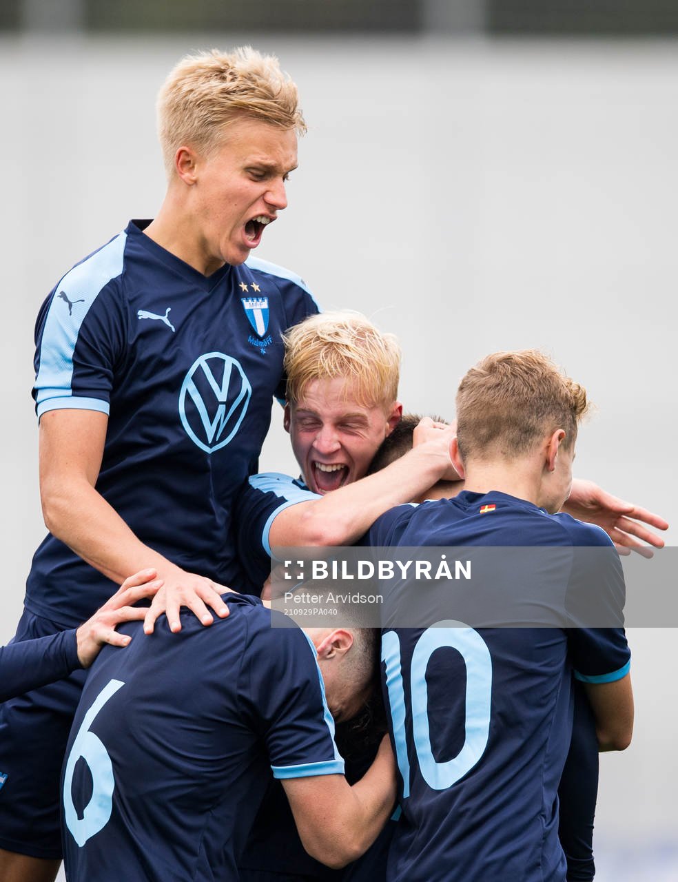 Ludvig Nicklasson and Emil Lindman celebrate with Isak Bjerkebo after his 2-2 goal during the UEFA Youth League match between Zenit St Petersburg and Malmö FF on September 29, 2021 in Saint Petersburg. 