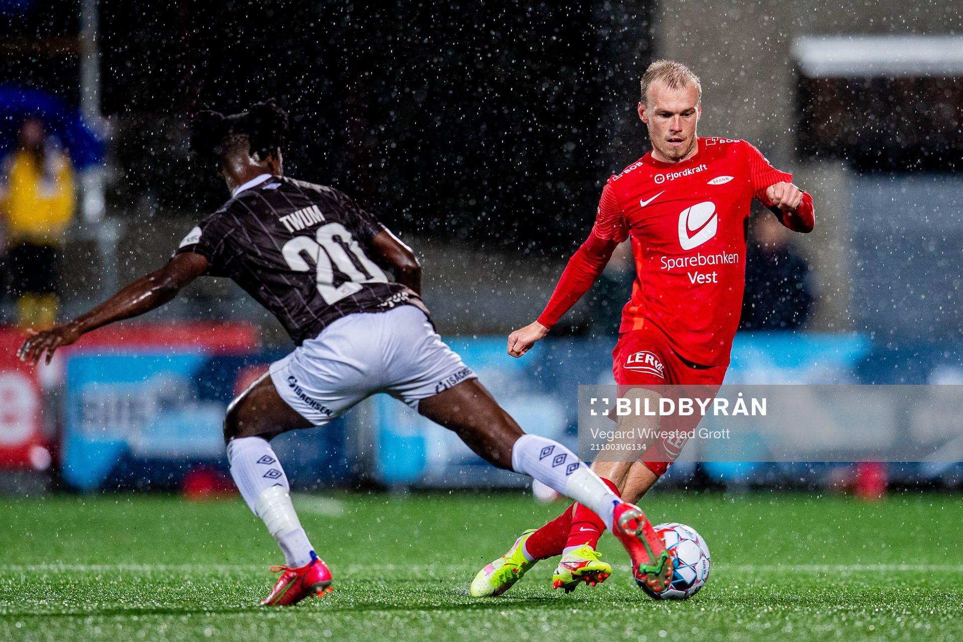 Isaac Twum of Mjøndalen and Petter Strand of Brann