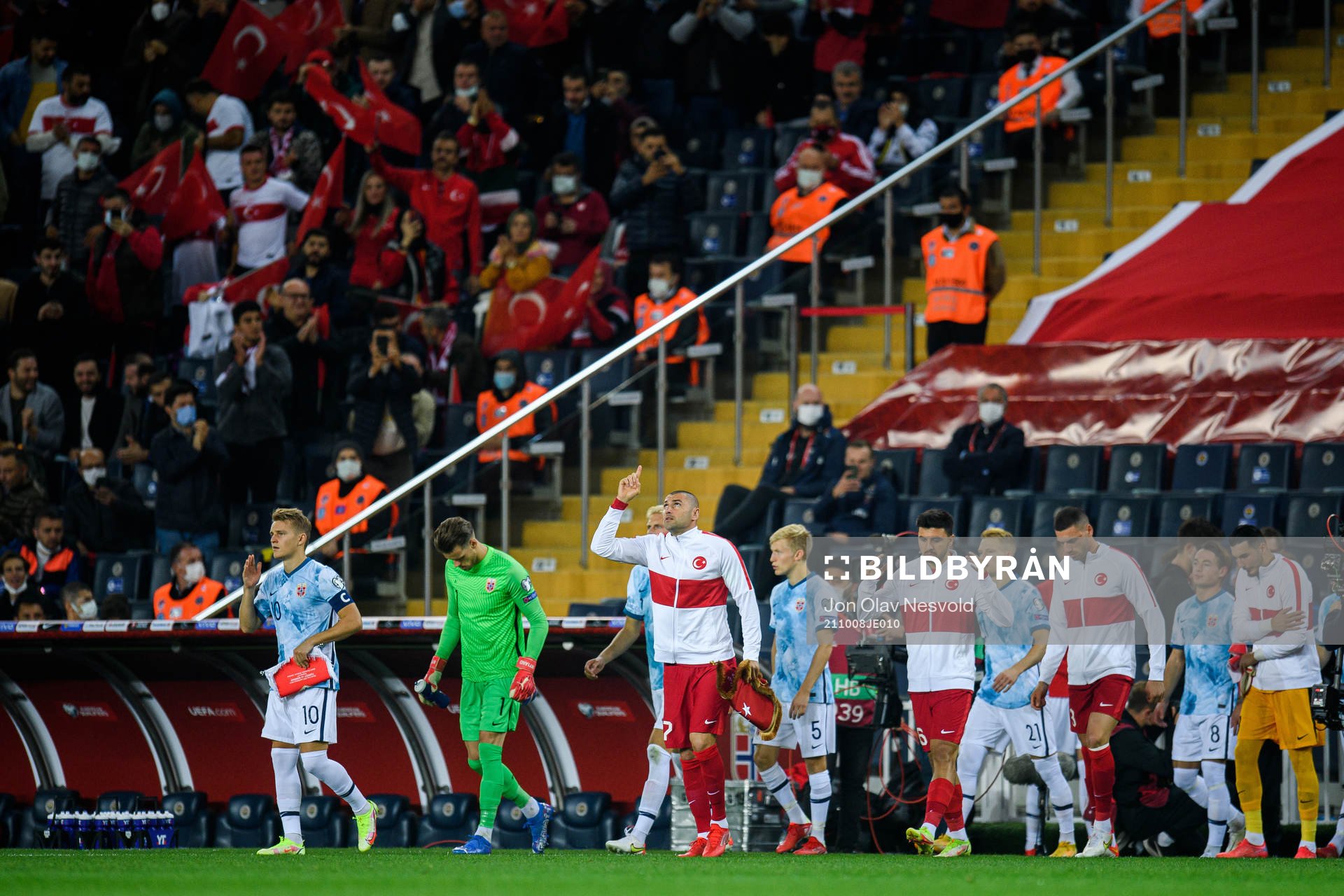 Players of Norway and of Turkey enter the pitch