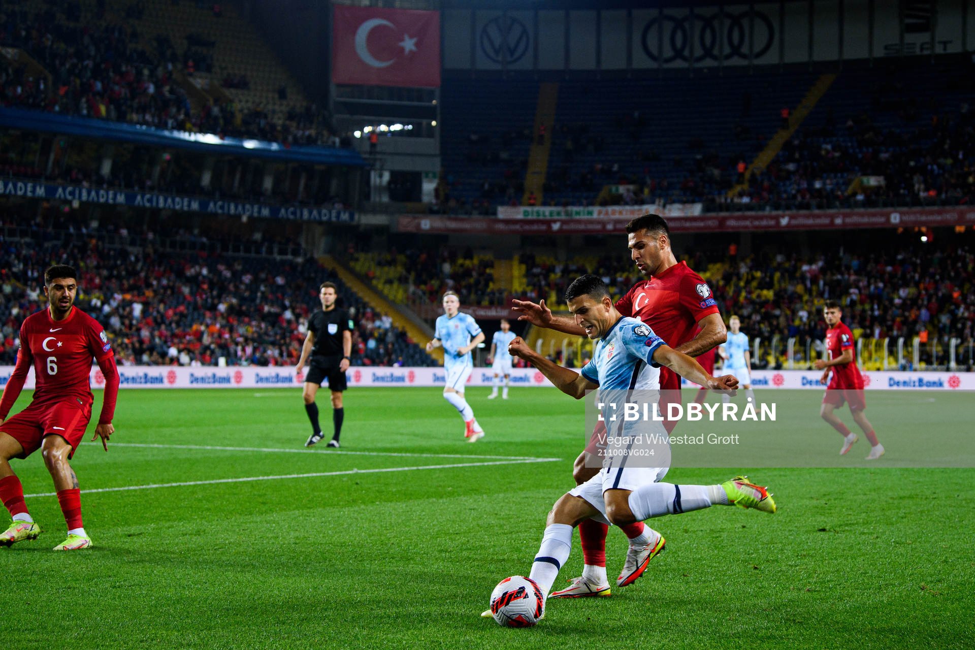Mohamed Elyounoussi of Norway and Zeki Celik of Turkey