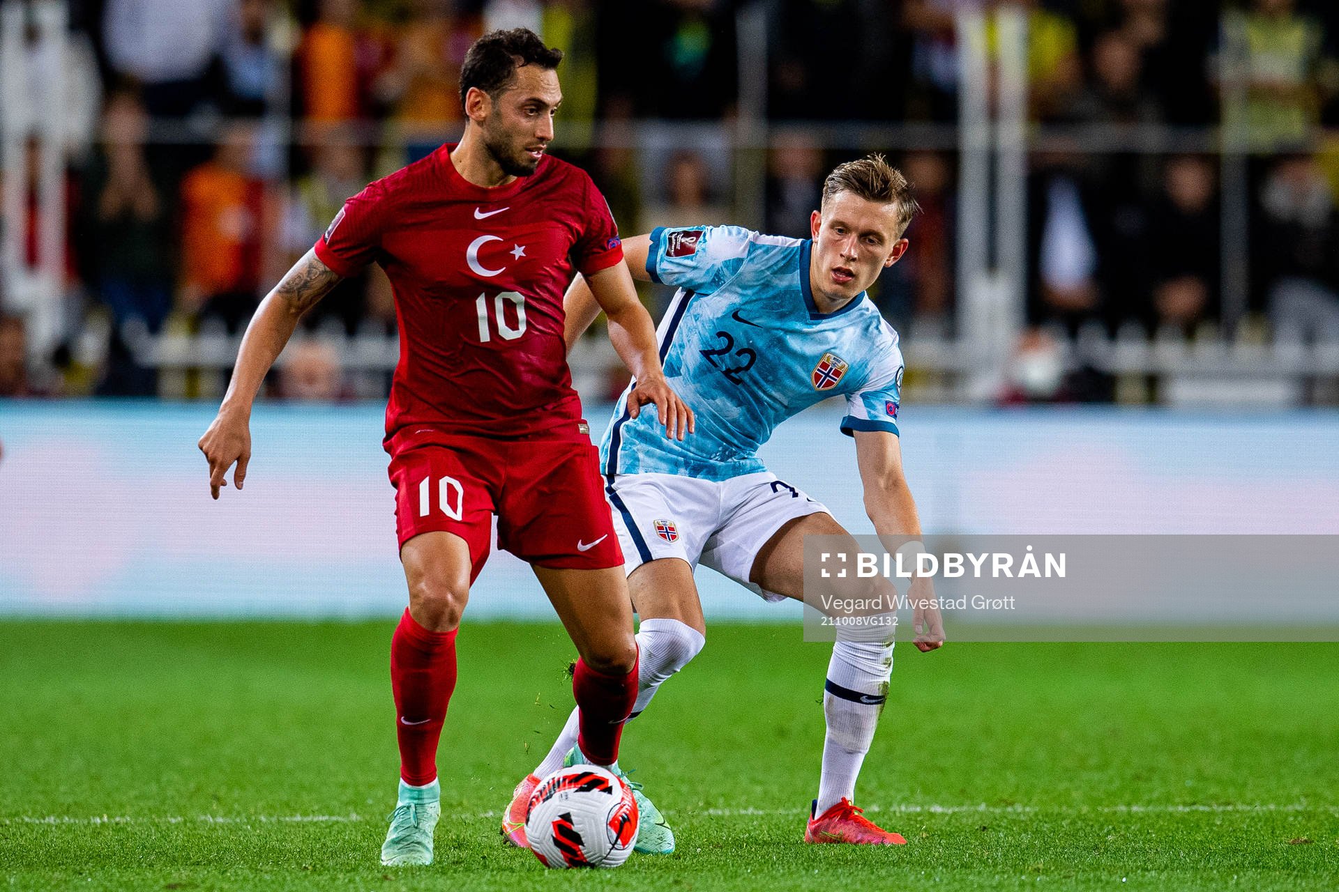 Hakan Calhanoglu of Turkey and Marcus Holmgren Pedersen of