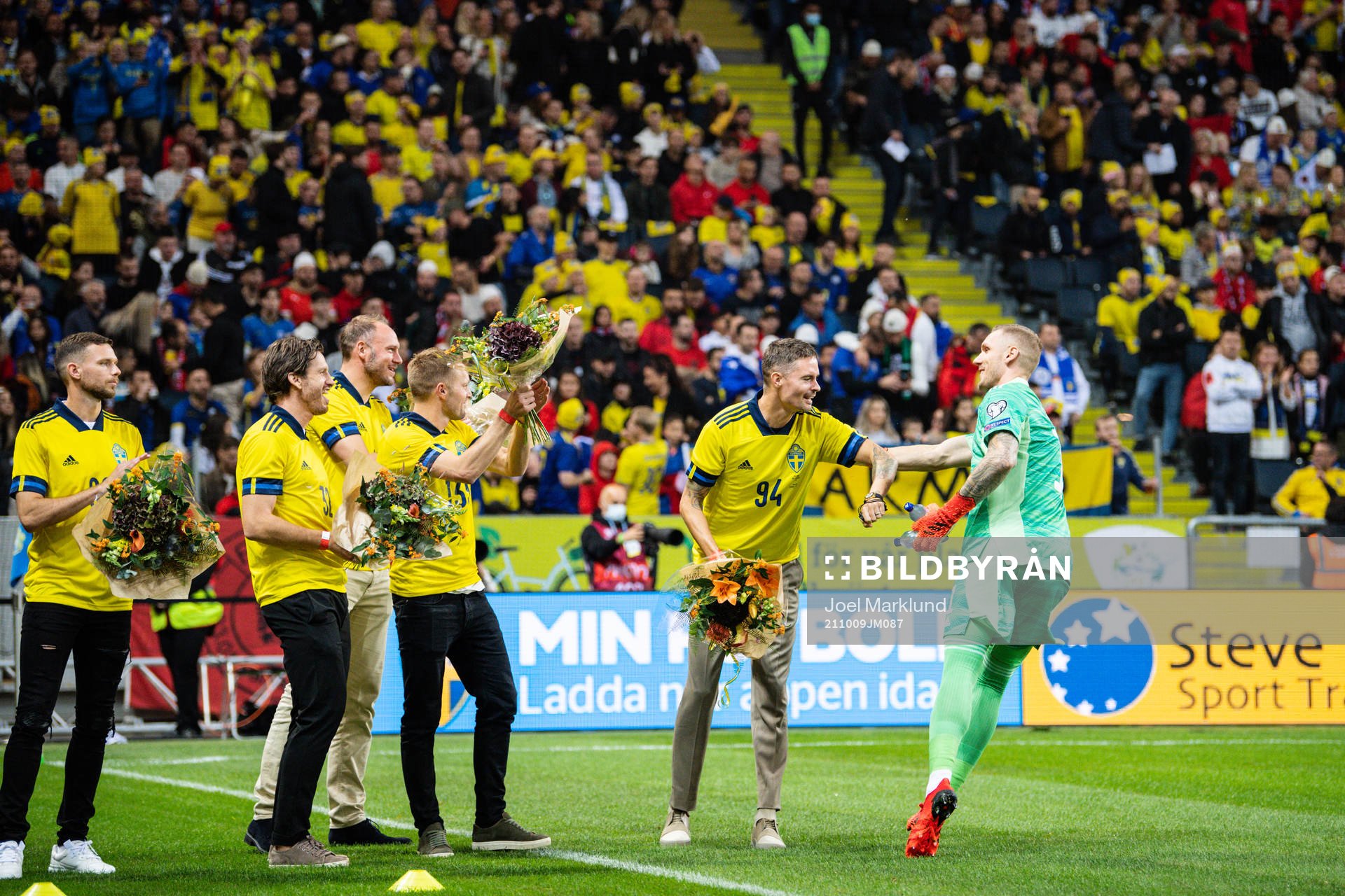 goalkeeper Robin Olsen with former players Sebastian