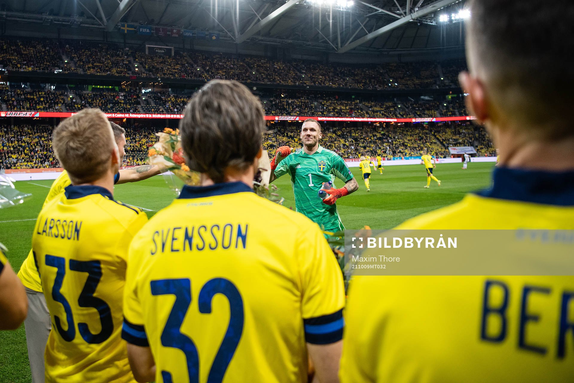 goalkeeper Robin Olsen with former players Sebastian