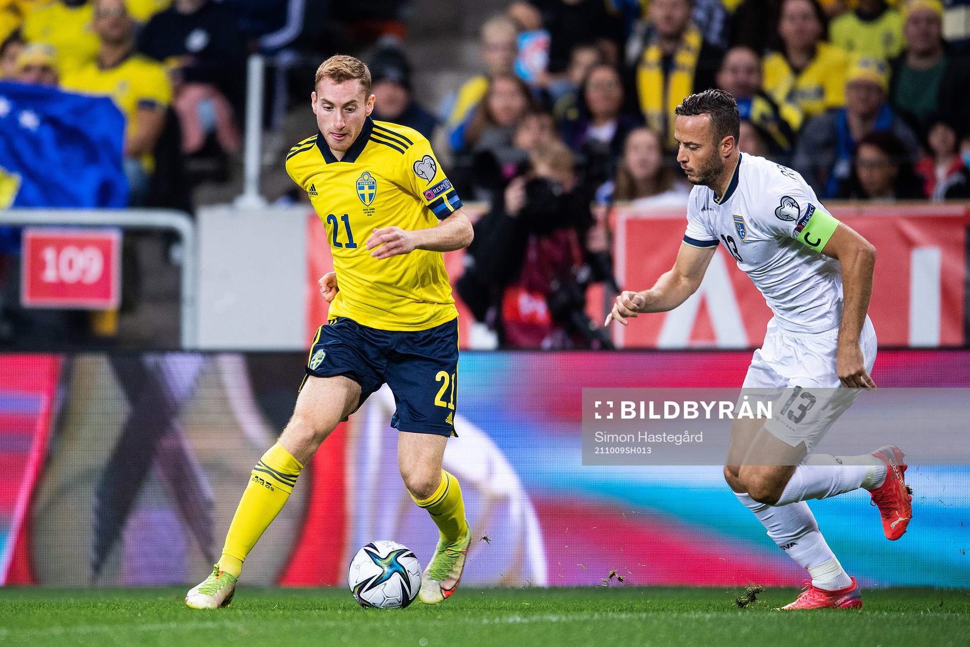 Dejan Kulusevski of Sweden and Amir Rrahmani of Kosovo
