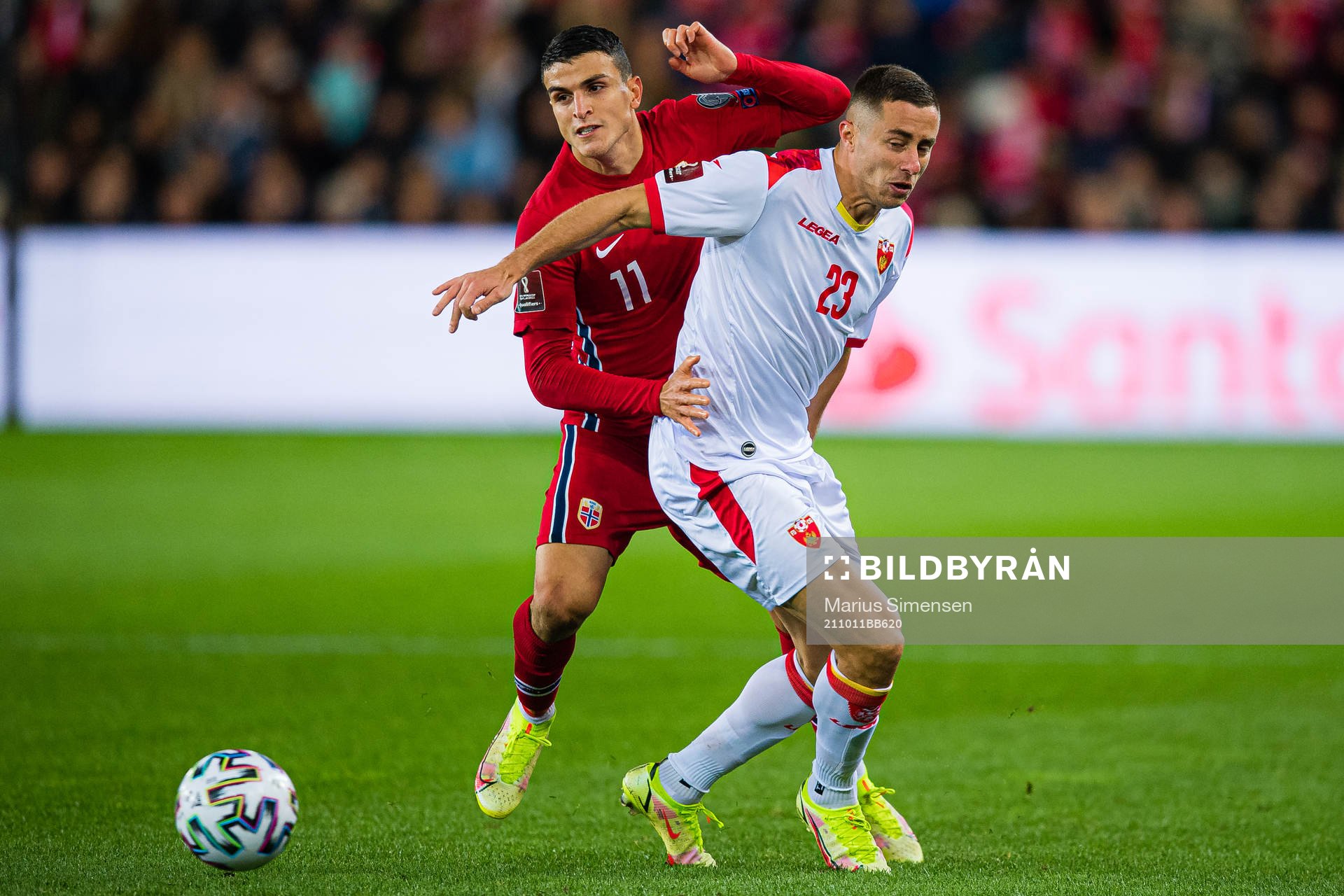 Mohamed Elyounoussi of Norway and Adam Marusic of Montenegro
