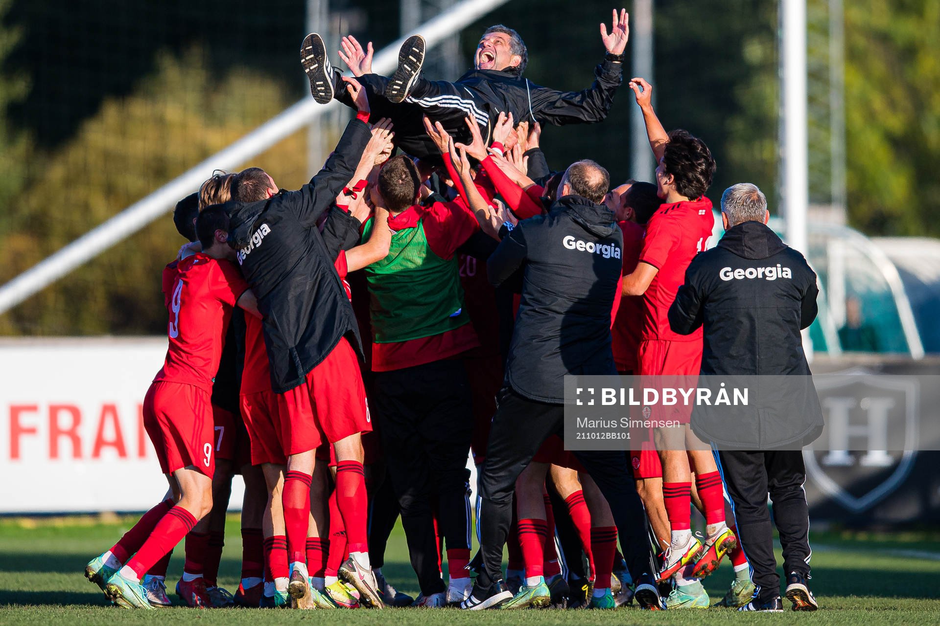 Players of Georgia celebrates with Vasil Maisuradze, head