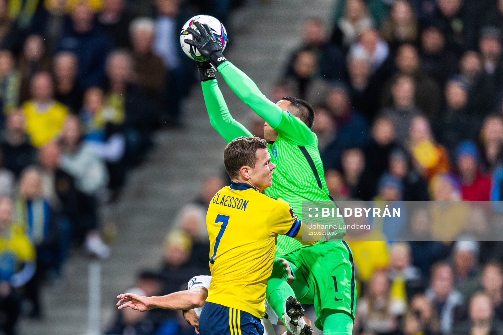Viktor Claesson of Sweden and goalkeeper Odisseas