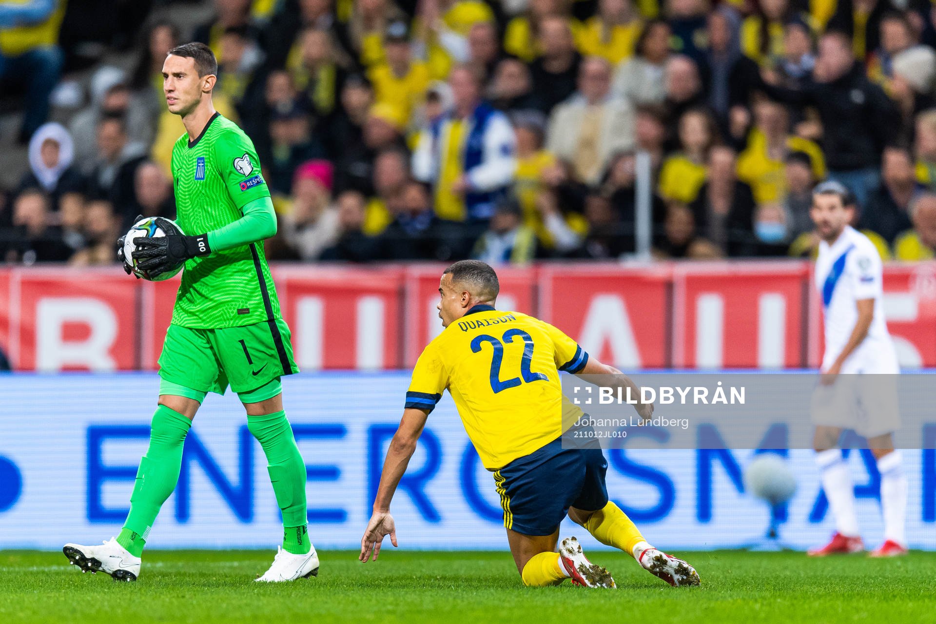 Goalkeeper Odisseas Vlachidimos of Greece as Robin Quaison