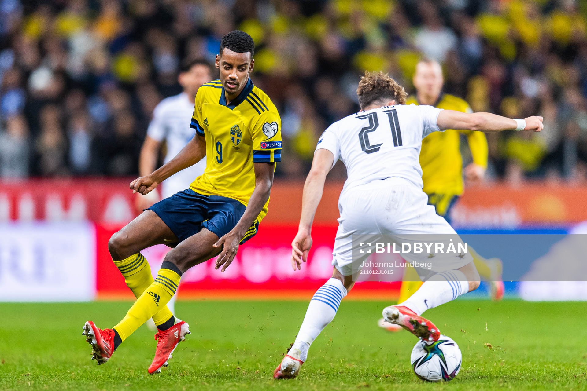 Alexander Isak of Sweden and Kostas Tsimikas of Greece