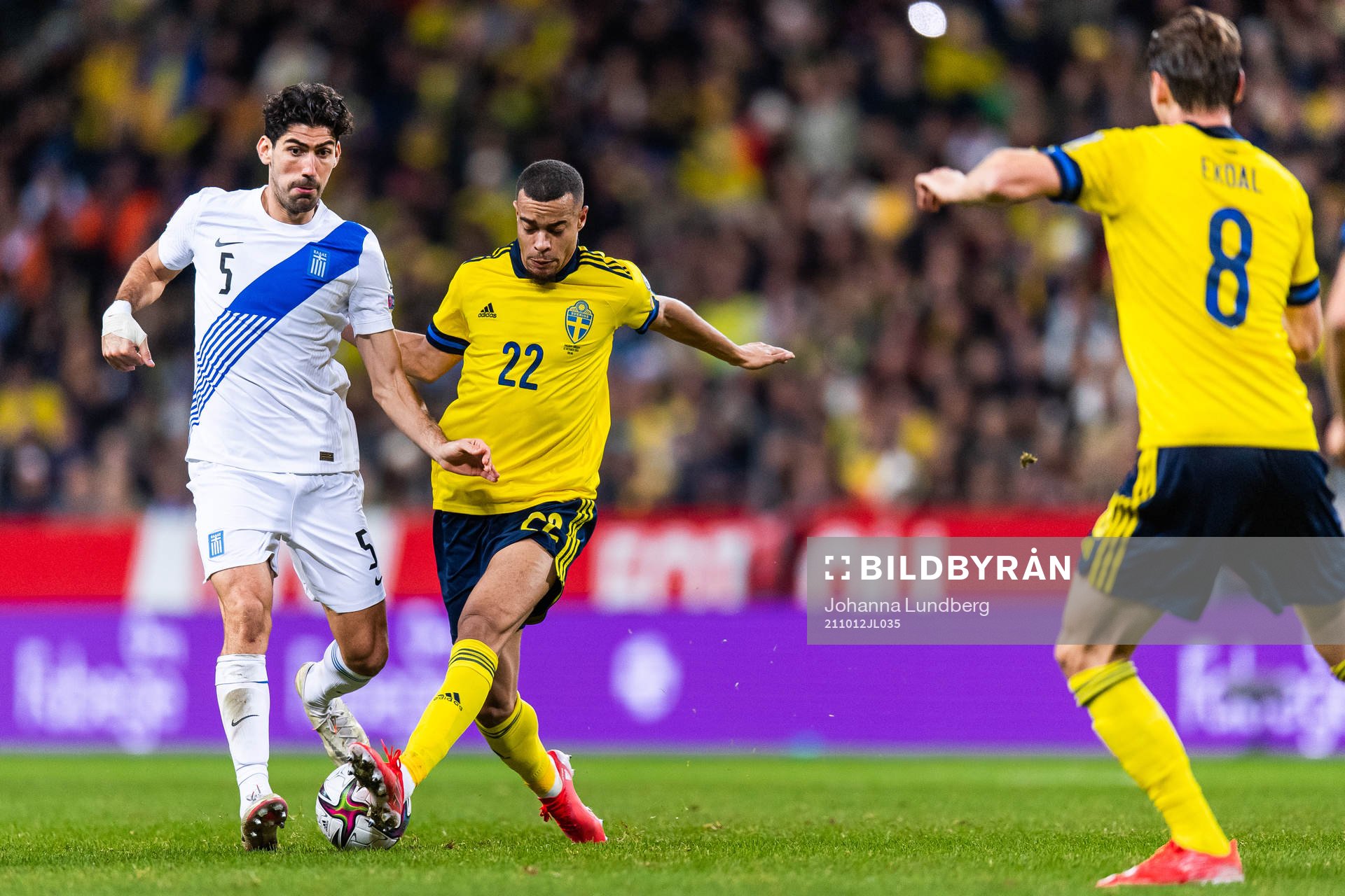 Andreas Bouchalakis of Greece and Robin Quaison of Sweden during the FIFA World Cup Qualifier football match between Sweden and Greece on October 12, 2021 in Stockholm.