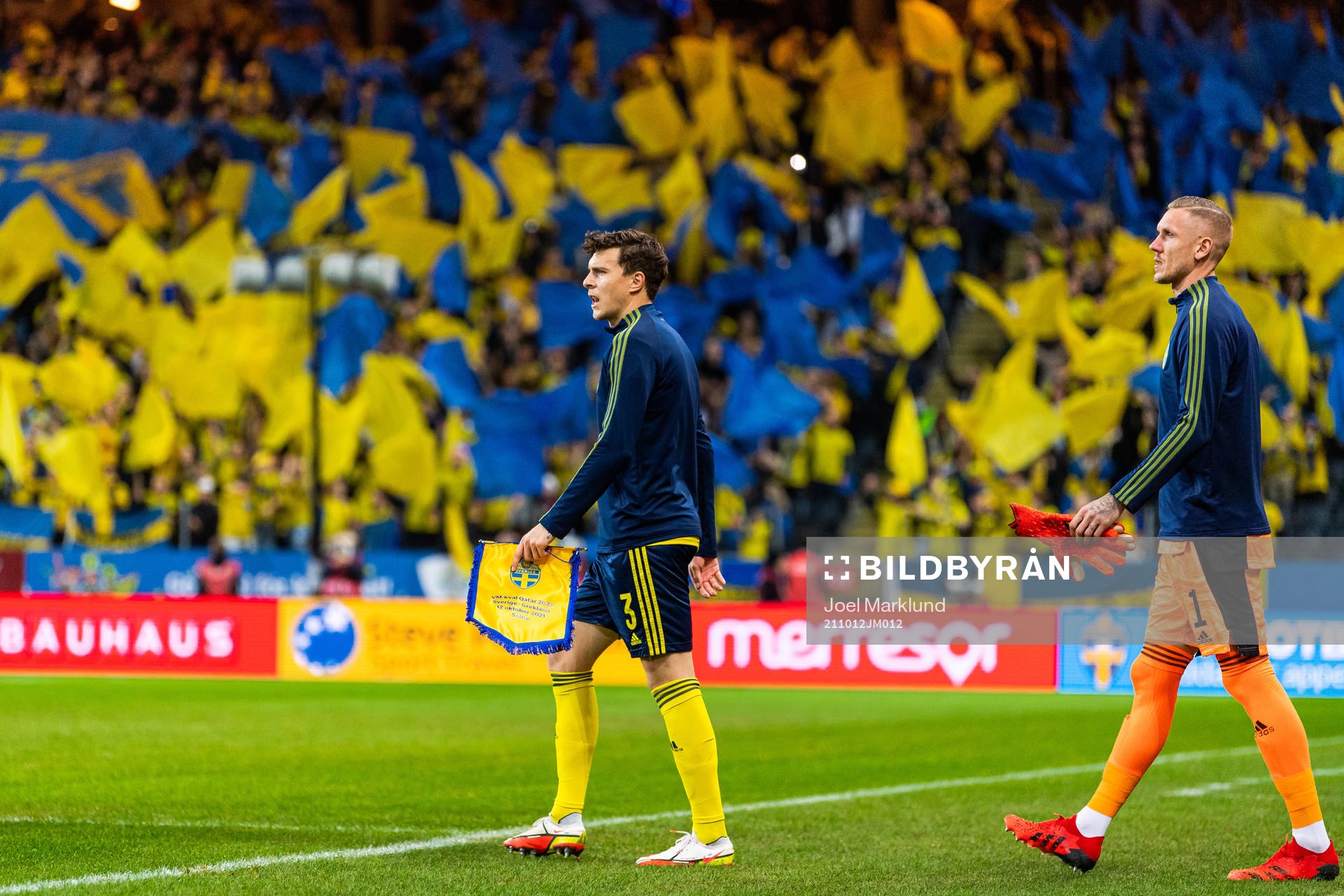 Victor Nilsson Lindelöf and goalkeeper Robin Olsen enter