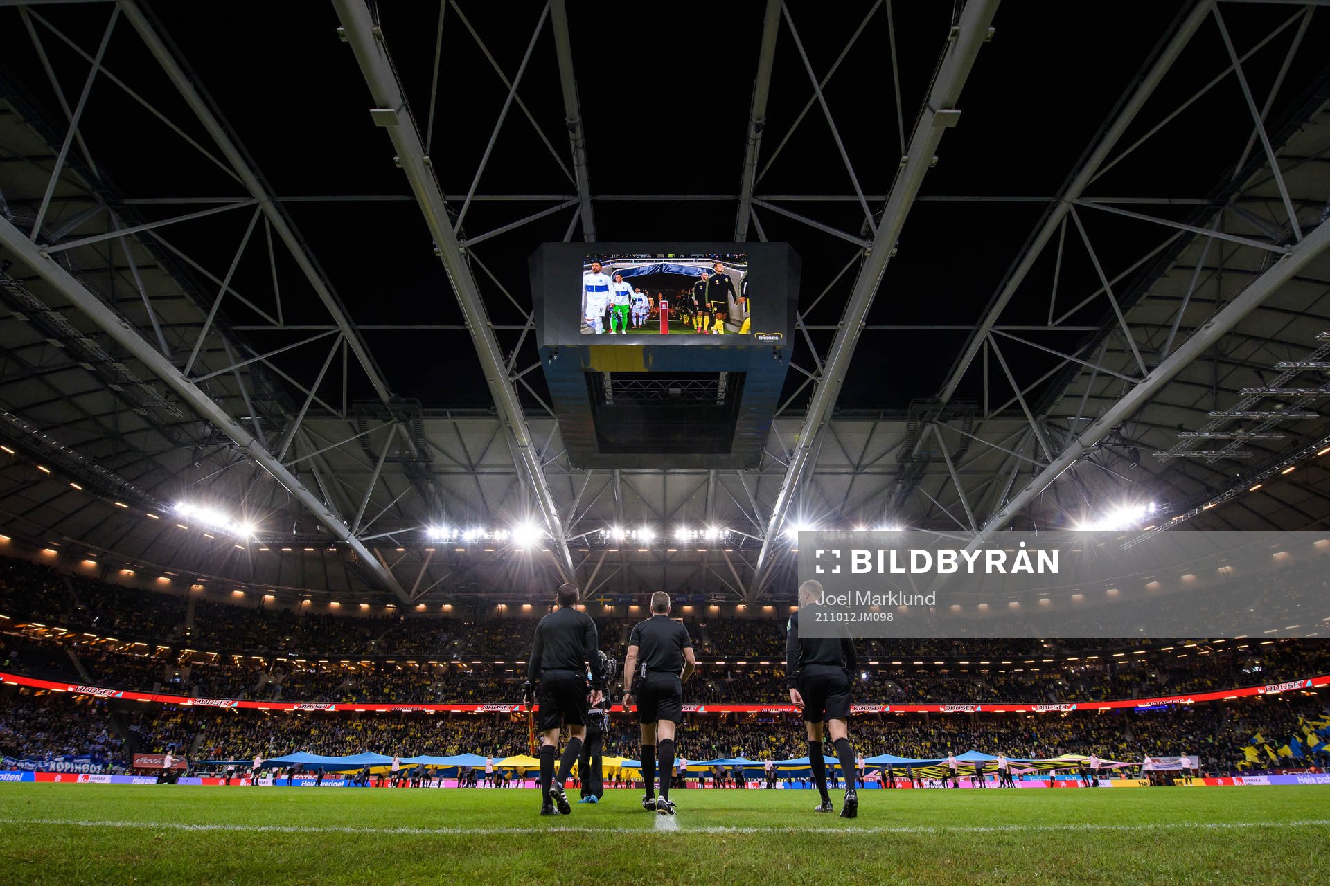 The referees enter the pitch for the FIFA World Cup