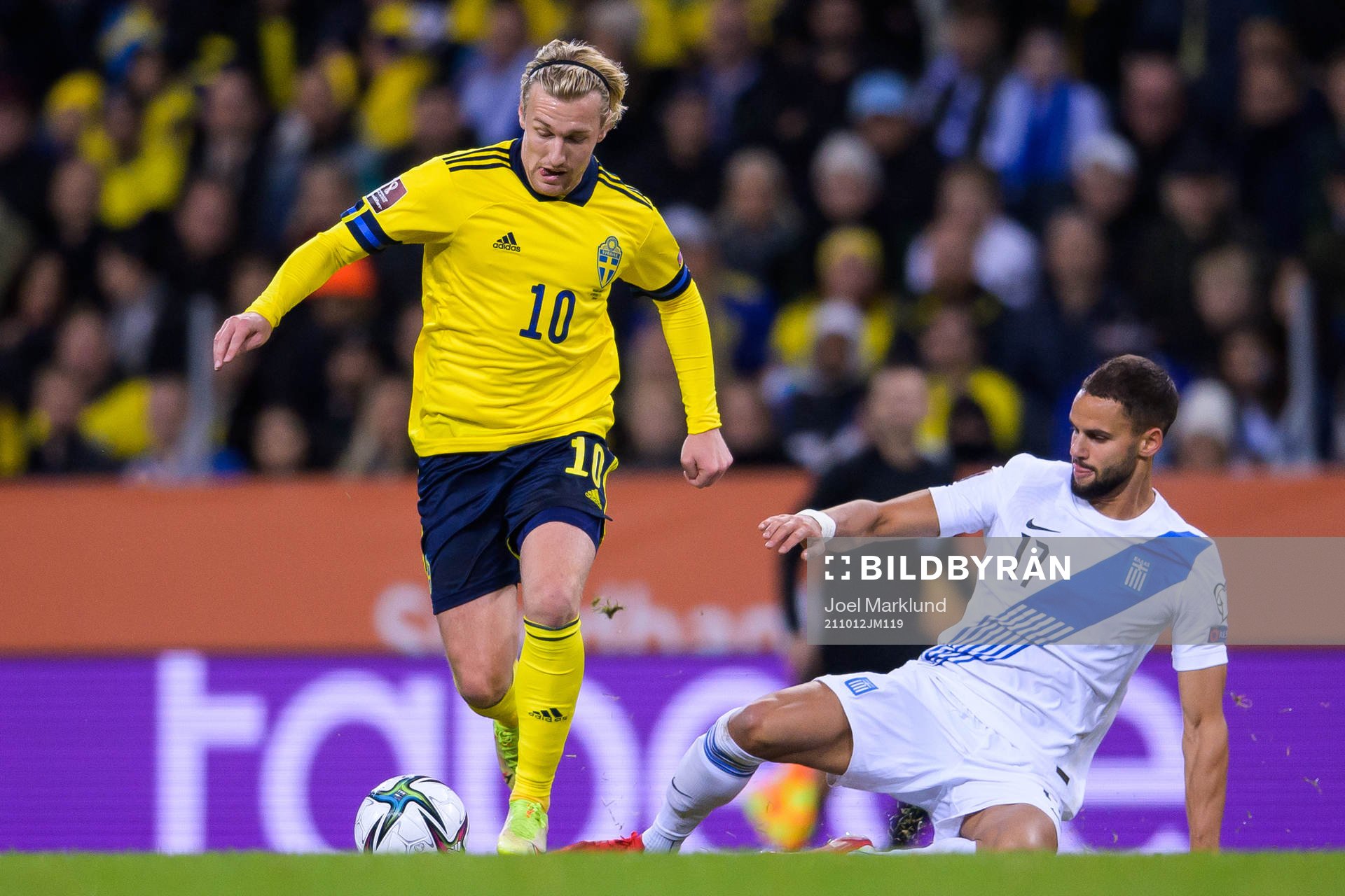Emil Forsberg of Sweden and Pantelis Hatzidiakos of Greece