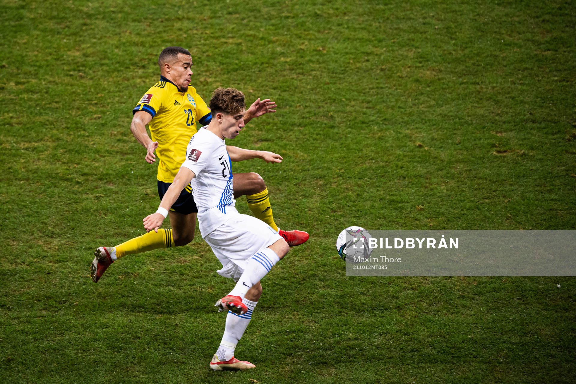 Robin Quaison of Sweden and Kostas Tsimikas of Greece