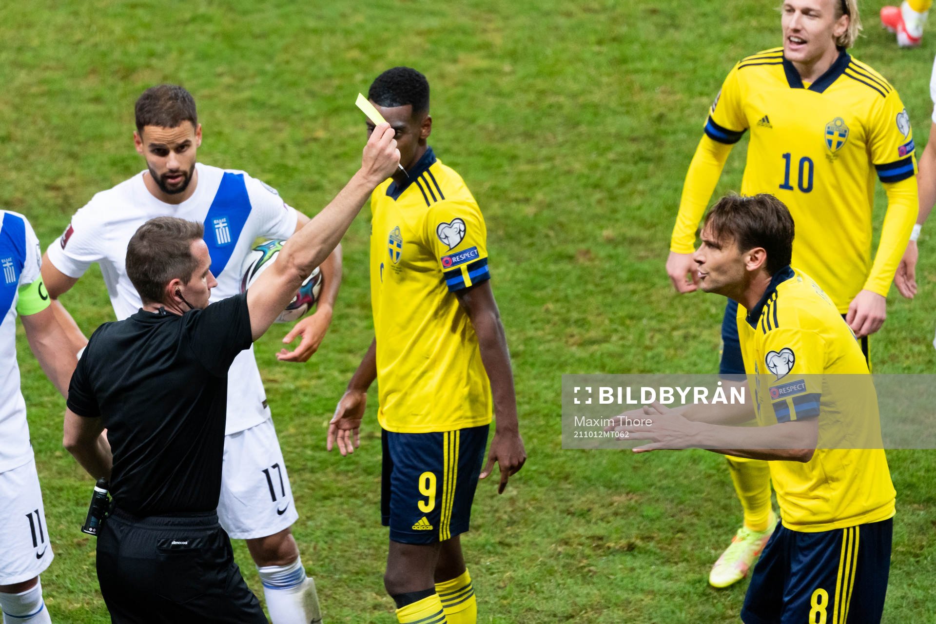 Albin Ekdal of Sweden receives a yellow card