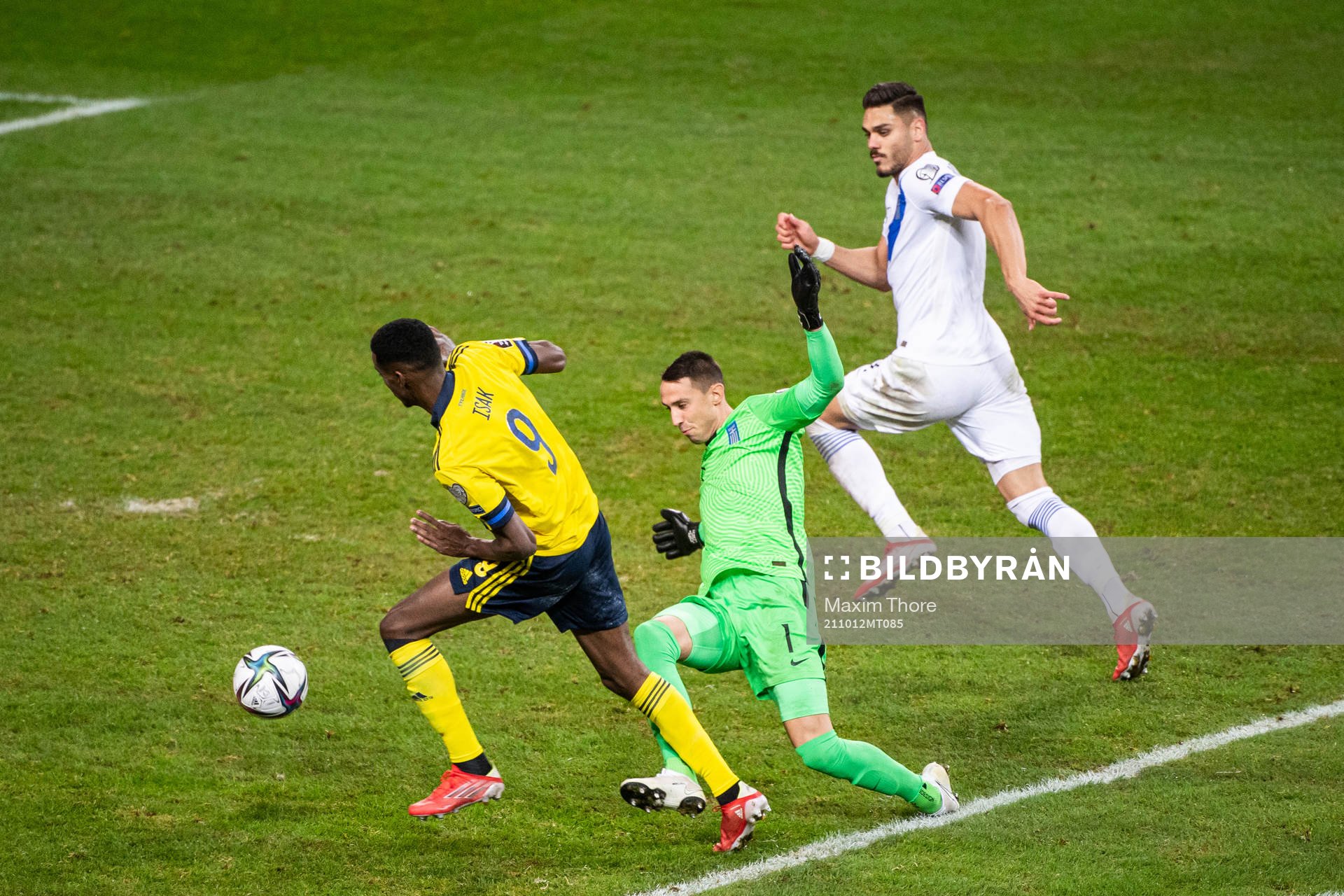 Alexander Isak of Sweden and goalkeeper Odisseas
