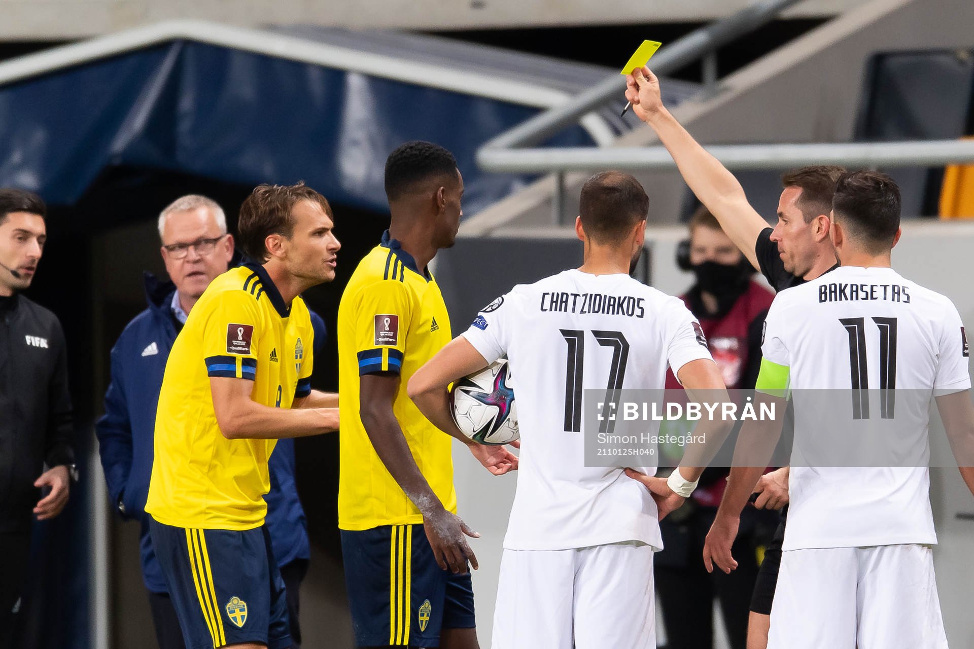 Albin Ekdal of Sweden receives a yellow card