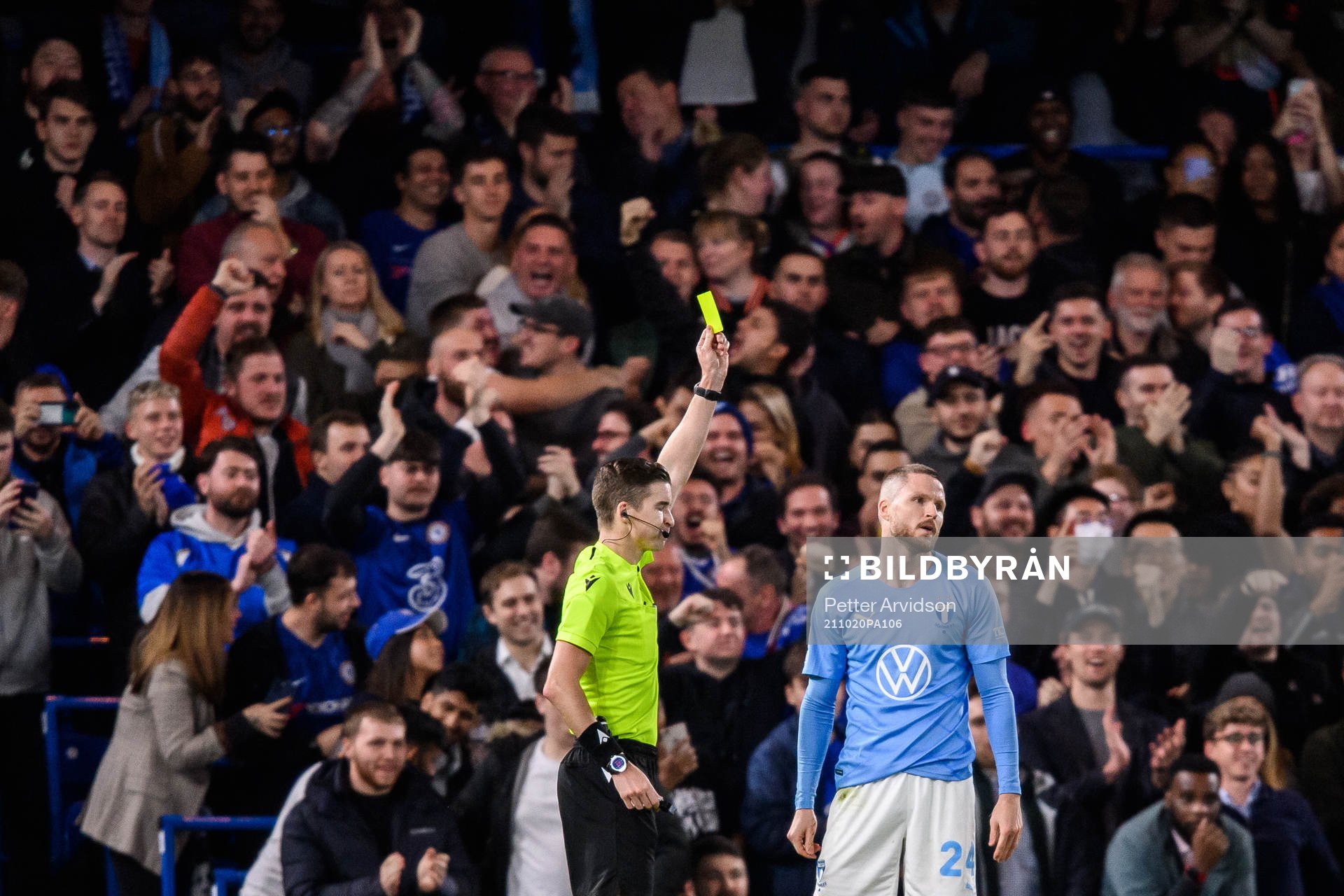 Lasse Nielsen of Malmö FF is shown a yellow card by