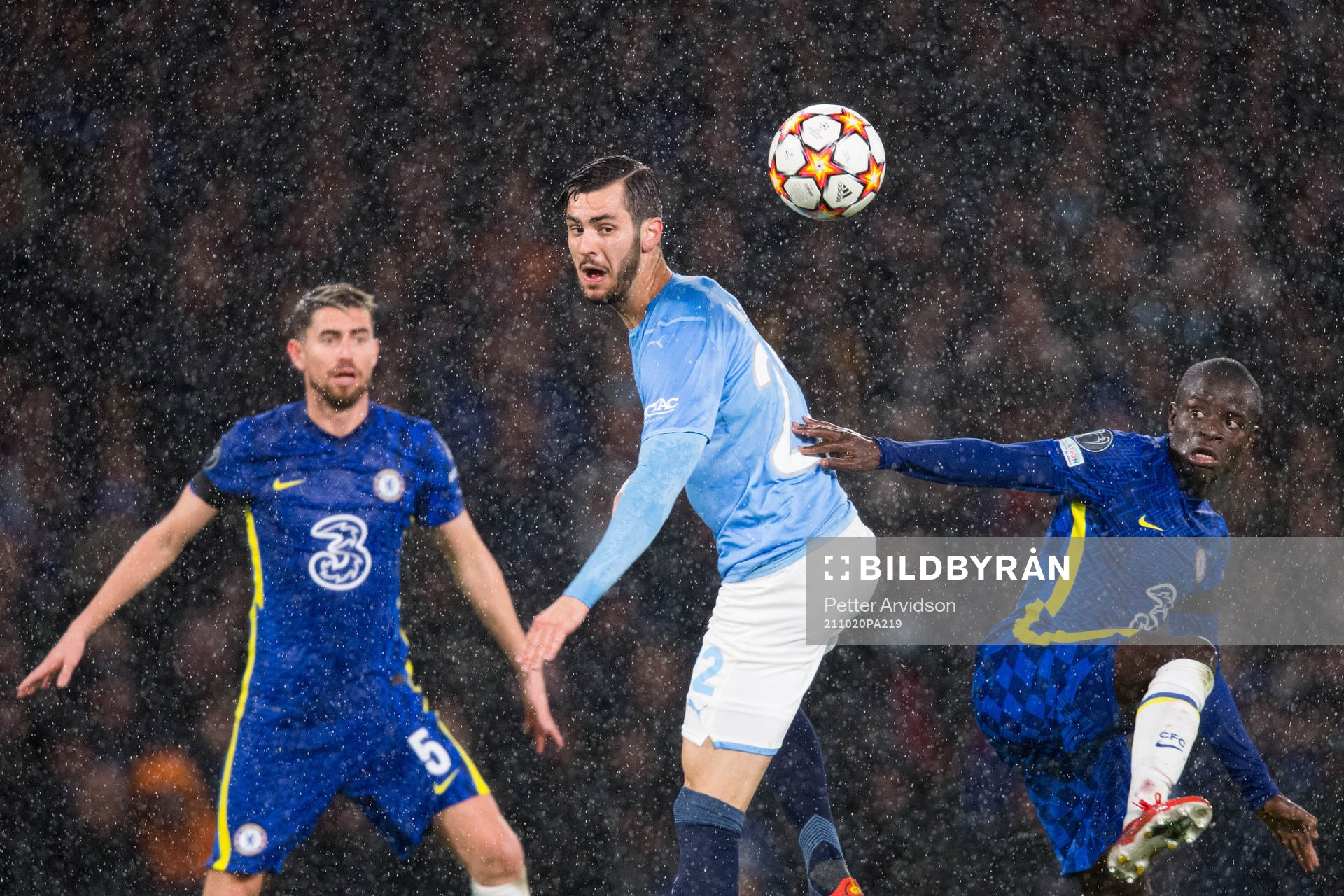 Adi Nalic of Malmö FF against Jorginho and N'Golo Kante of
