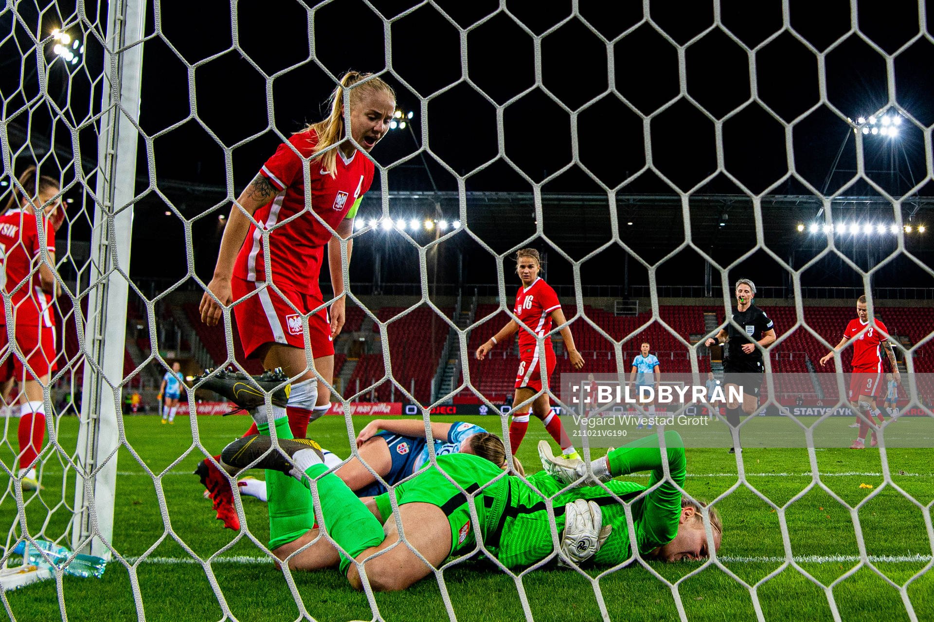 Paulina Dudek and goalkeeper Karolina Klabis of Poland