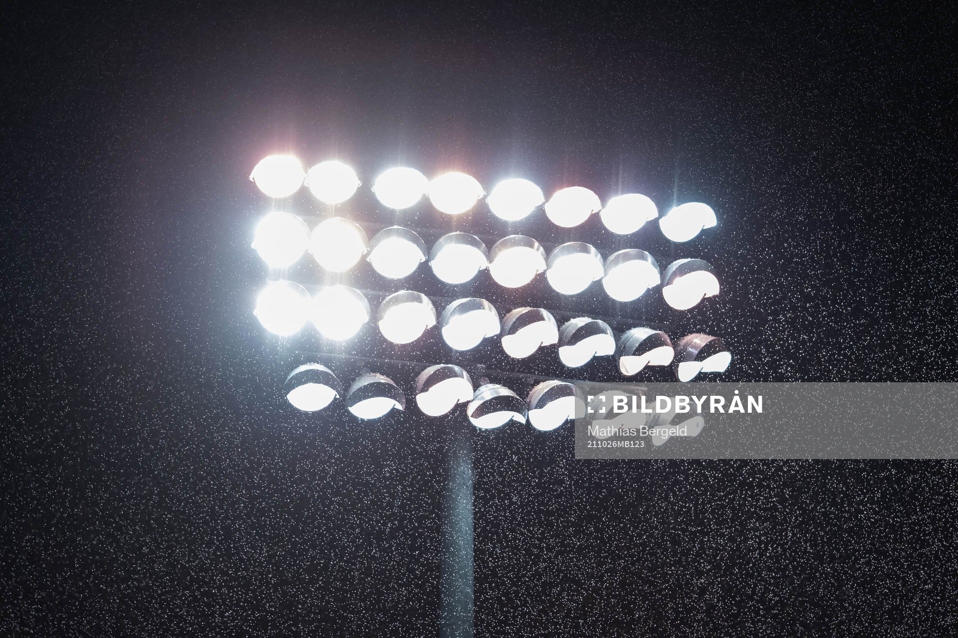 Rain is seen in front of the flood lights