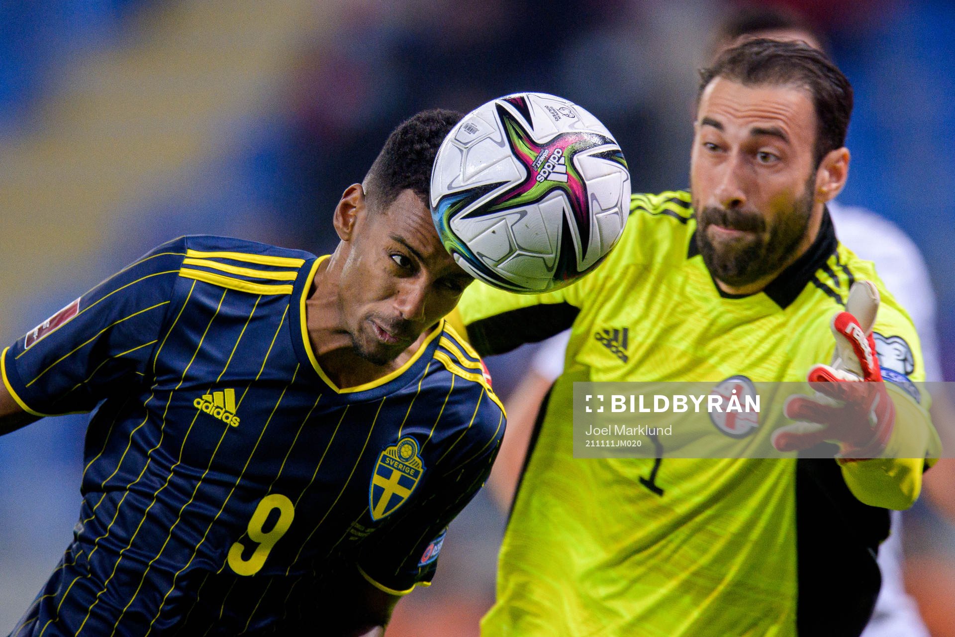 Alexander Isak of Sweden and goalkeeper Giorgi Loria of