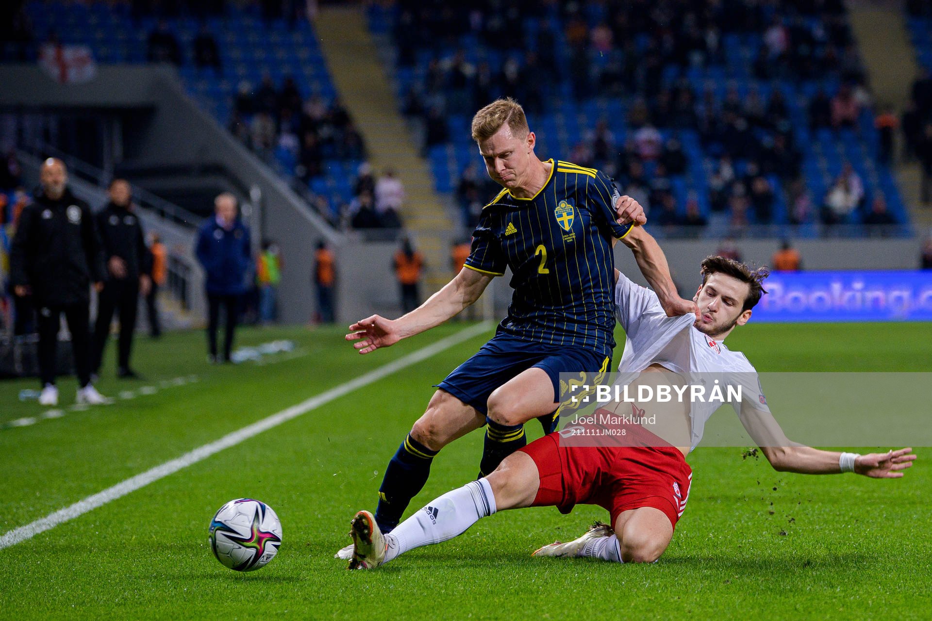 Emil Krafth of Sweden and Khvicha Kvaratskhelia of Georgia