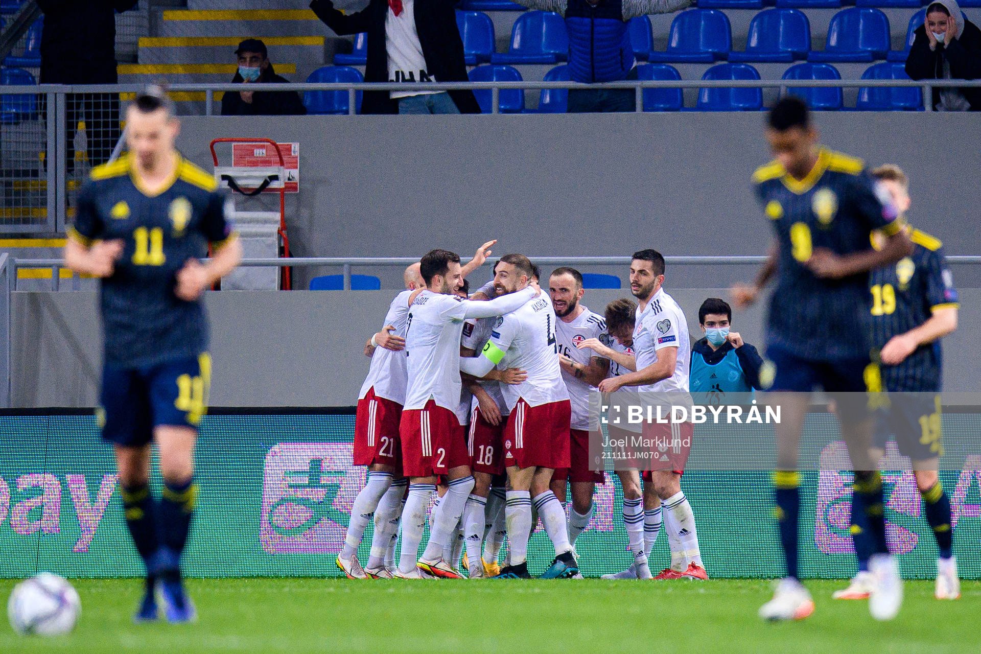 Players of Georgia celebrate the 1-0 goal by Khvicha