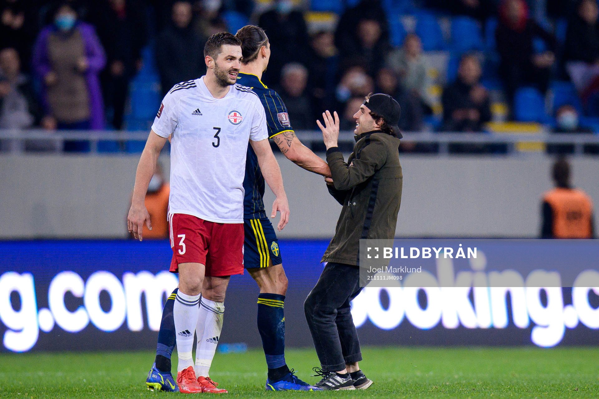 A pith invader next to Zlatan Ibrahimovic of Sweden