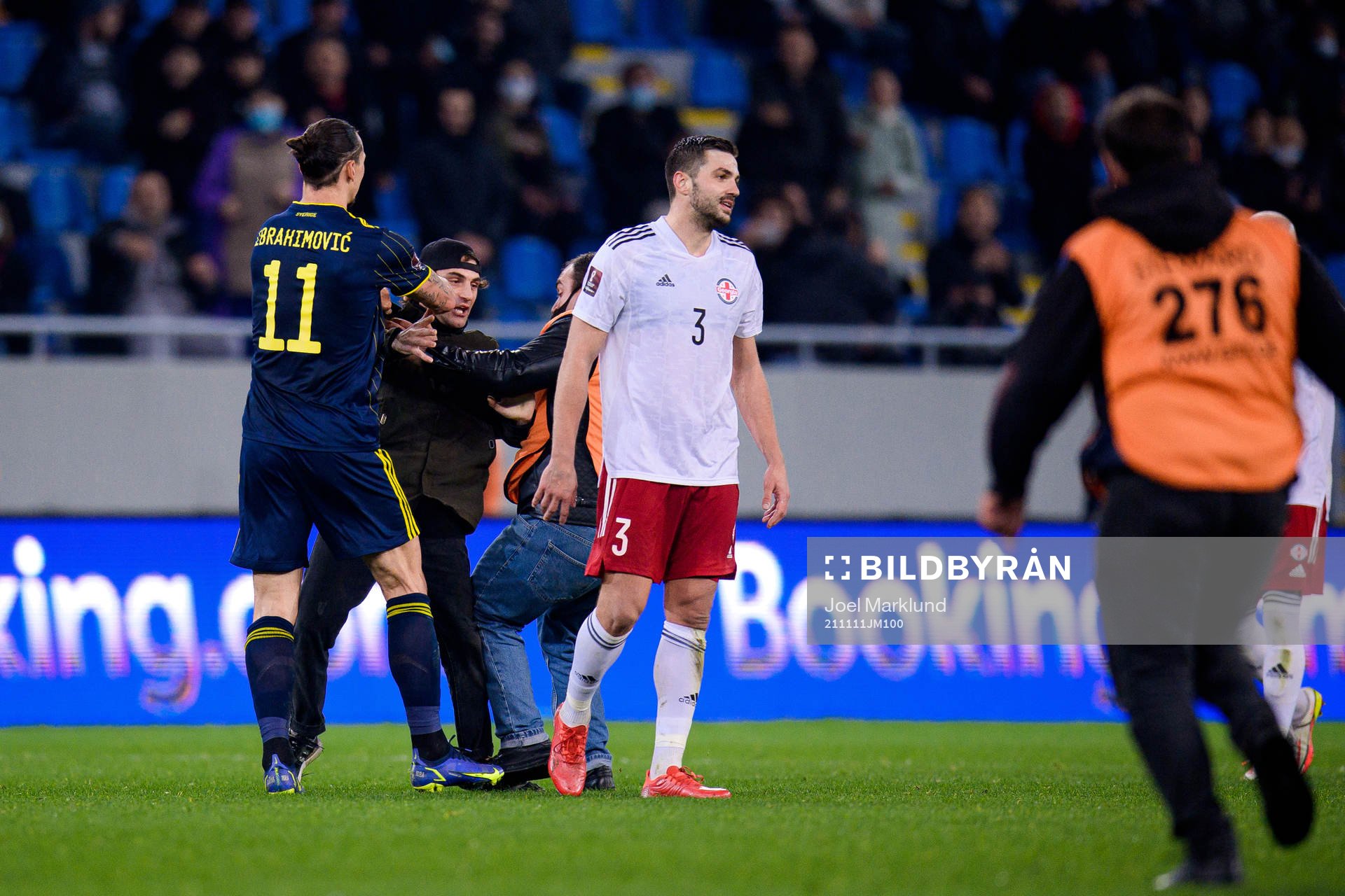 A pith invader next to Zlatan Ibrahimovic of Sweden