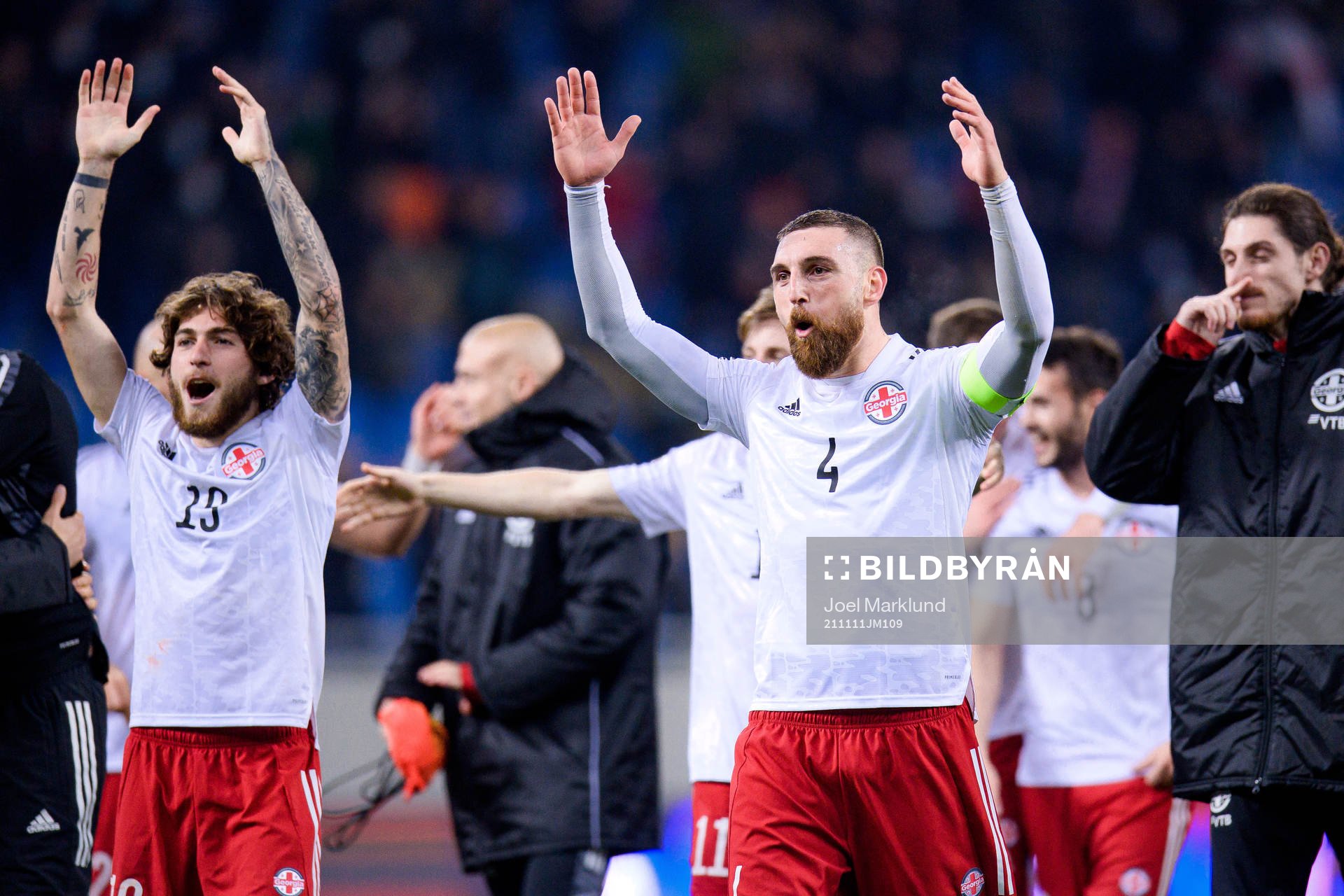Giorgi Tsitaishvili and Guram Kashia of Georgia celebrate
