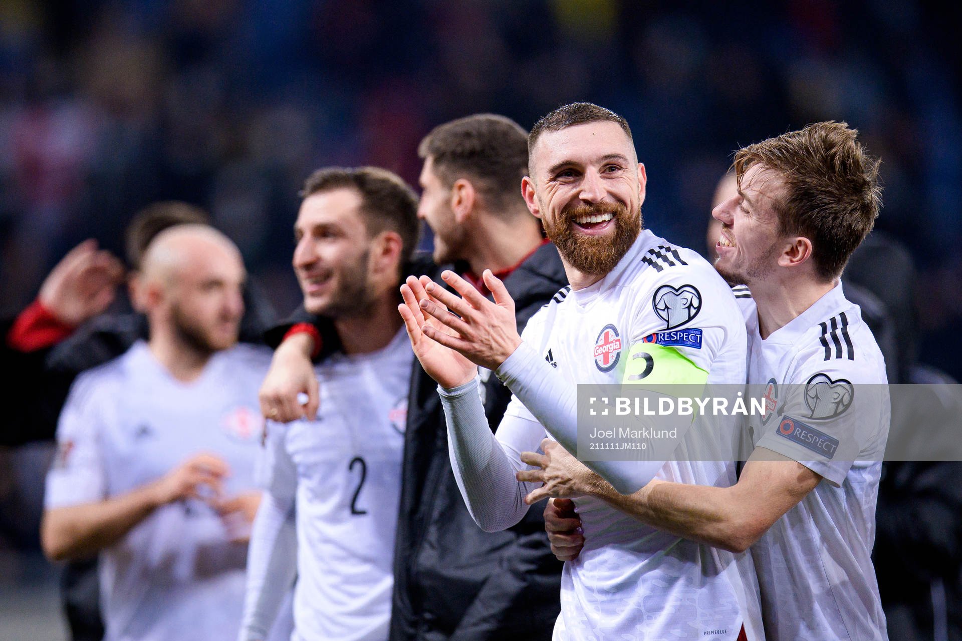 Guram Kashia and Saba Lobzhanidze of Georgia celebrate after the FIFA World Cup Qualifier football match between Georgia and Sweden on November 11, 2021 in Batumi.