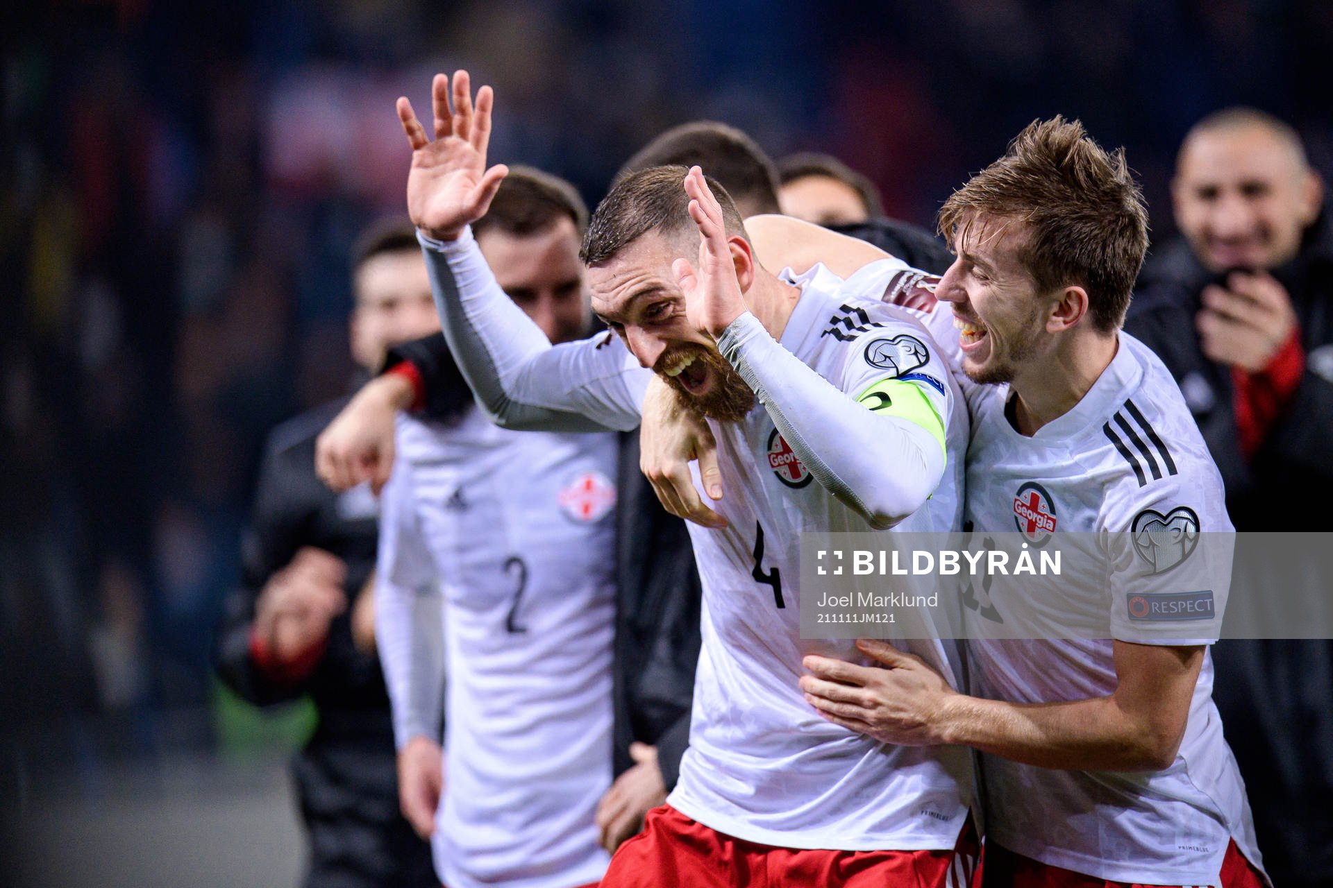 Guram Kashia and Saba Lobzhanidze of Georgia celebrate after the FIFA World Cup Qualifier football match between Georgia and Sweden on November 11, 2021 in Batumi.