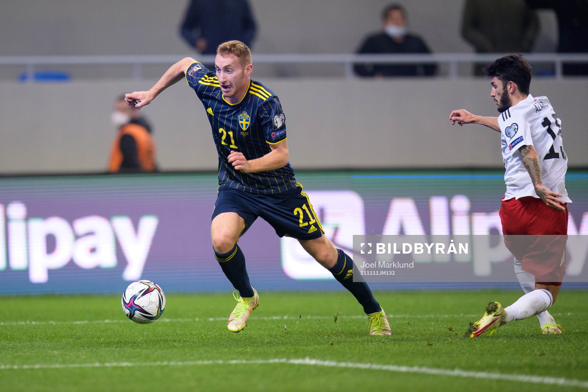 Dejan Kulusevski of Sweden and Irakli Azarov of Georgia during the FIFA World Cup Qualifier football match between Georgia and Sweden on November 11, 2021 in Batumi.