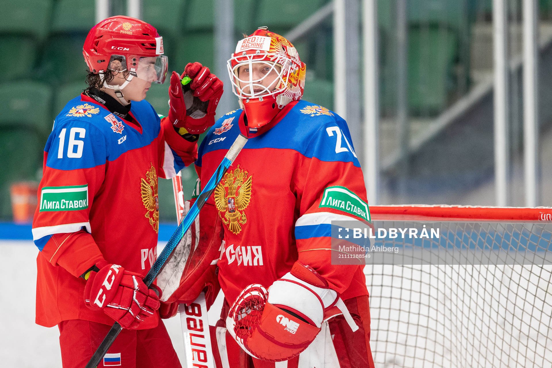 Daniil Kuzmin and goalkeeper Yegor Guskov of Russia
