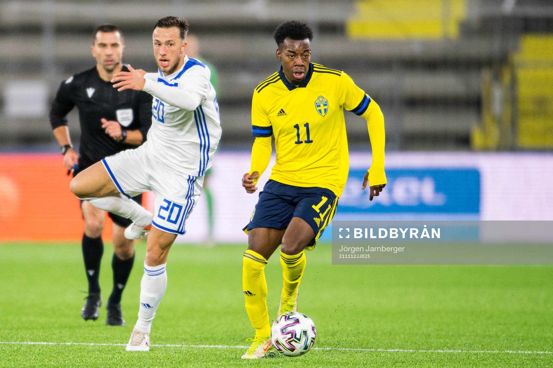 Andrej Dokanovic of Bosnia-Herzegovina and Anthony Elanga