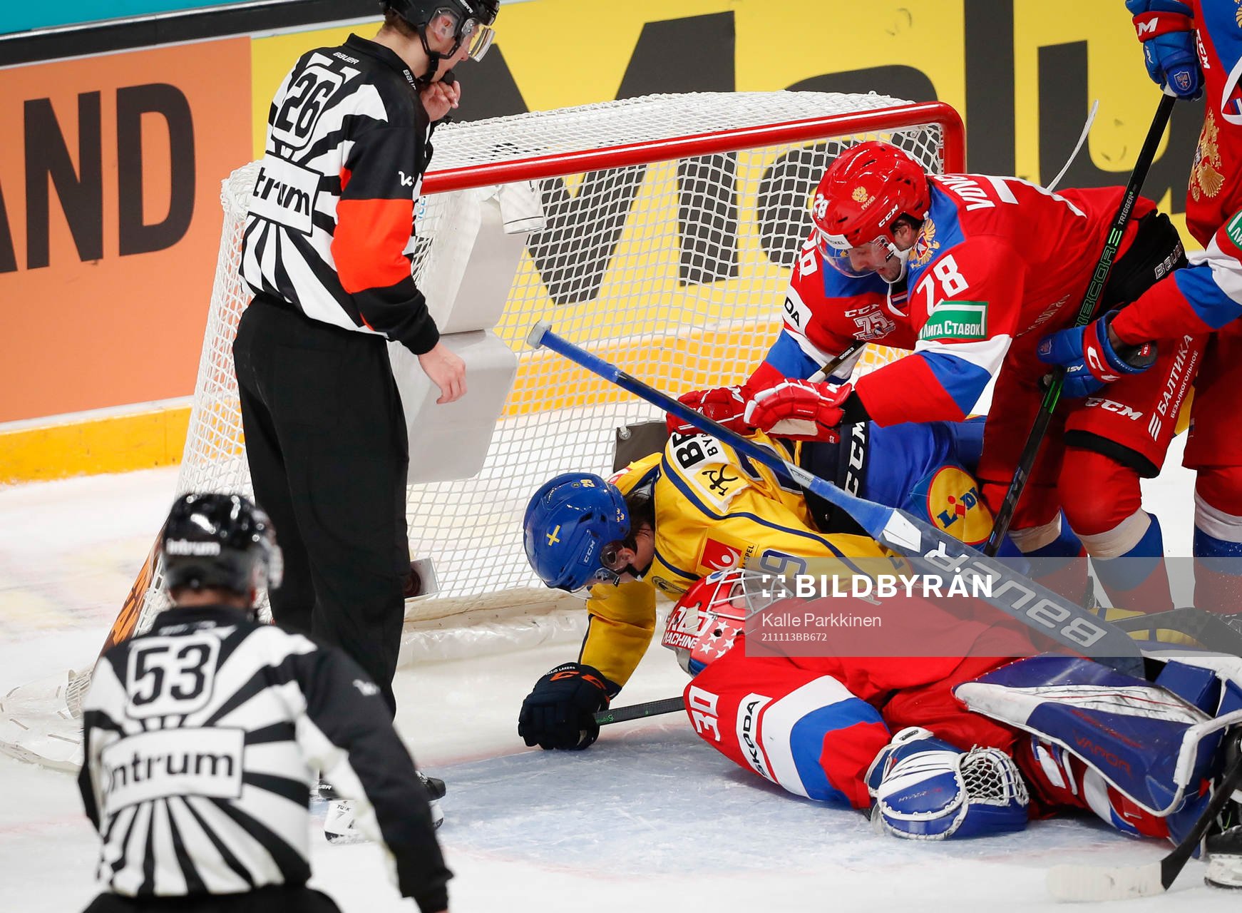 Pontus Holmberg of Sweden Daniil Vovchenko and goalie