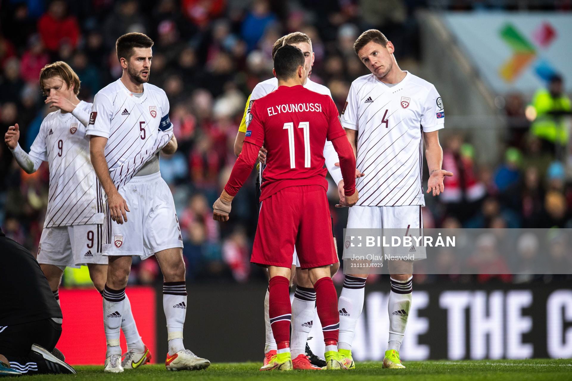 Mohamed Elyounoussi of Norway in a discussion with Martins