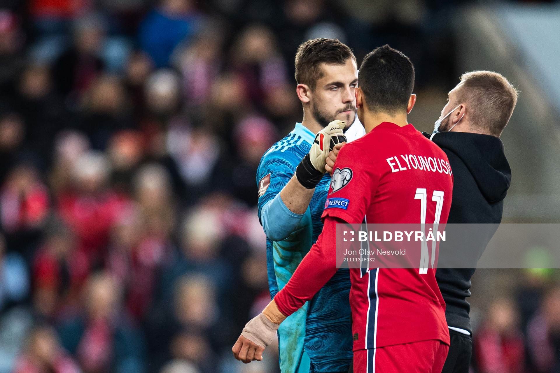 Goalkeeper Roberts Ozols of Latvia and Mohamed Elyounoussi