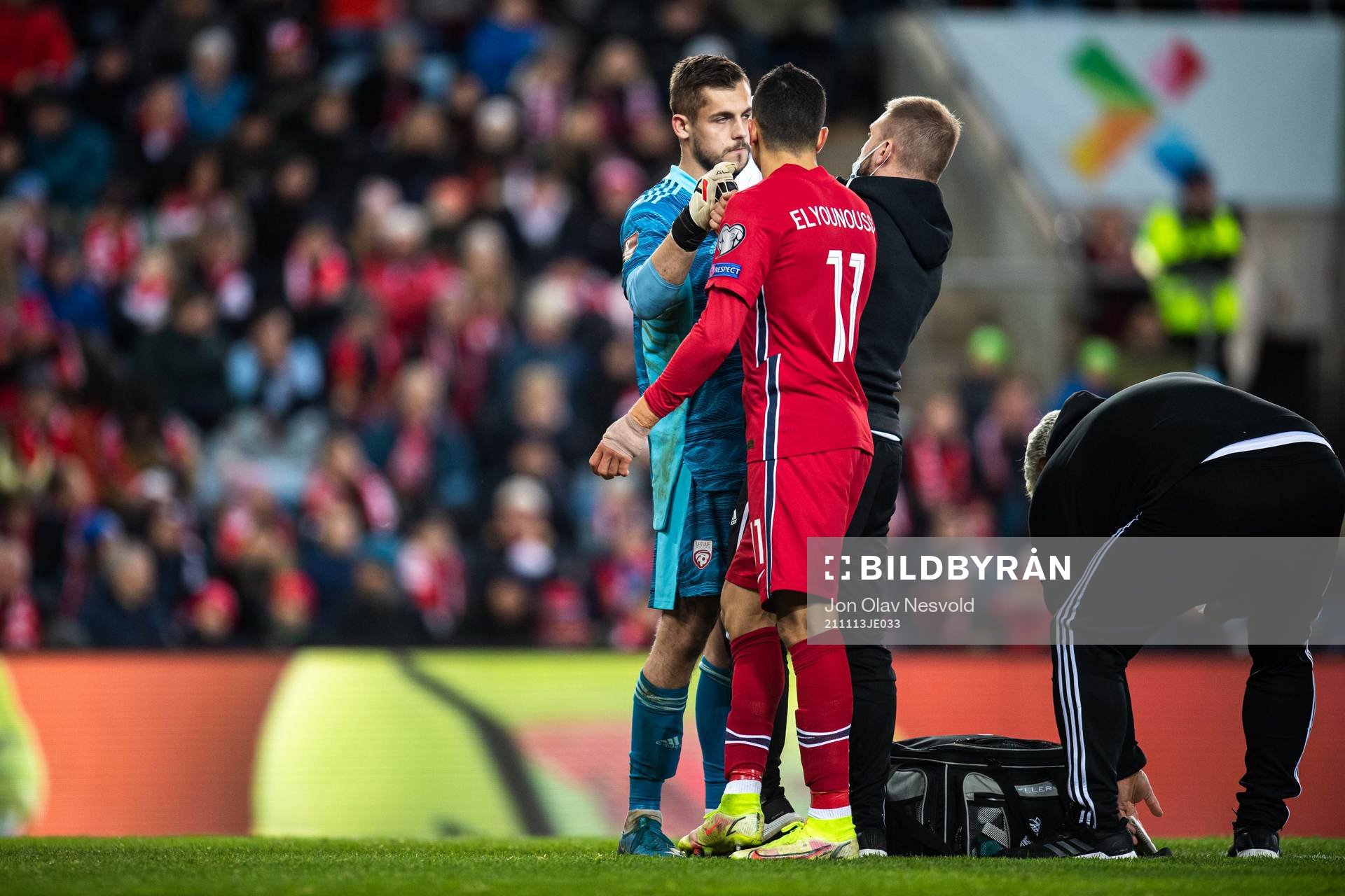 Goalkeeper Roberts Ozols of Latvia and Mohamed Elyounoussi