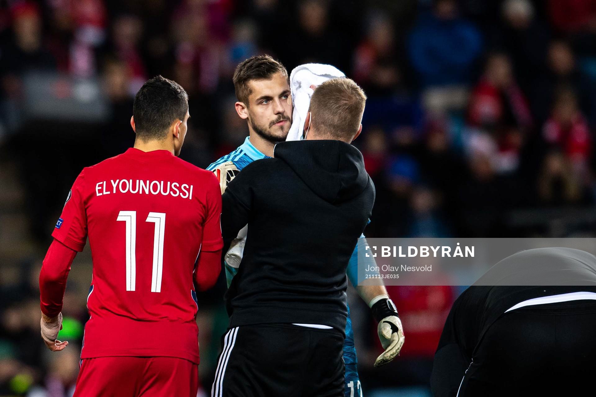 Goalkeeper Roberts Ozols of Latvia and Mohamed Elyounoussi