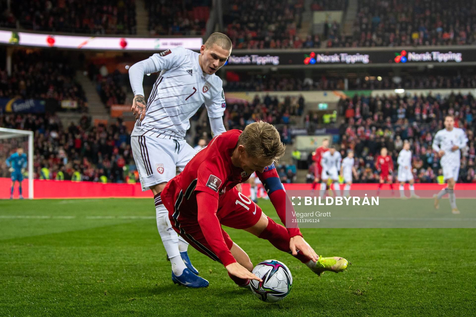 Vladimirs Kamess of Latvia and Martin Ødegaard of Norway