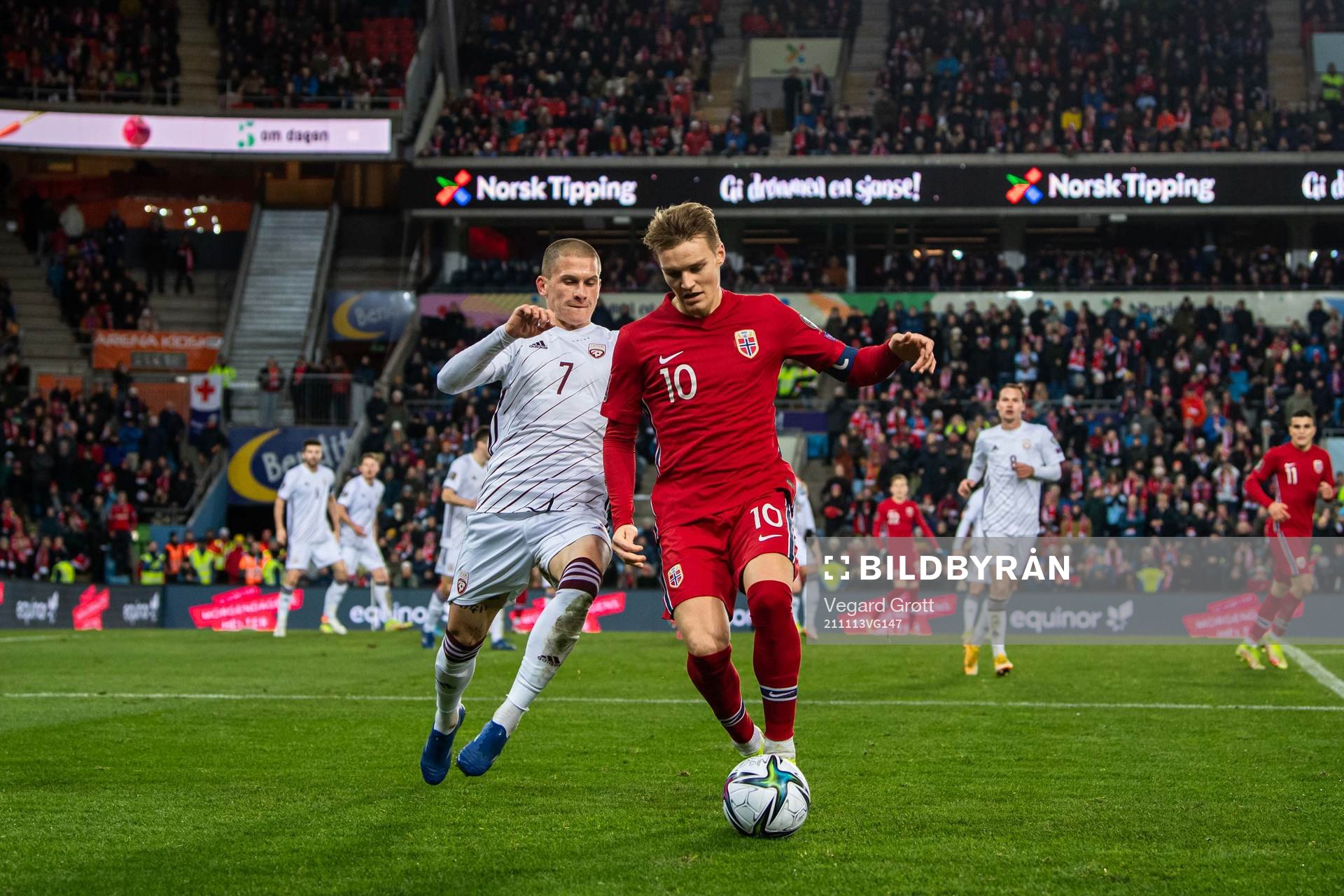 Vladimirs Kamess of Latvia and Martin Ødegaard of Norway
