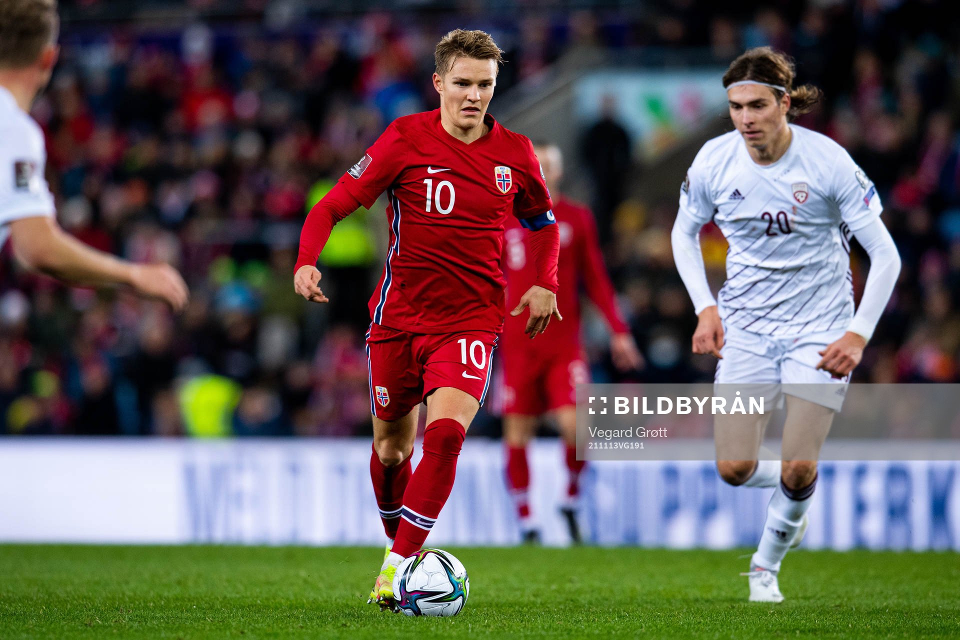 Martin Ødegaard of Norway and Roberts Uldrikis of Latvia