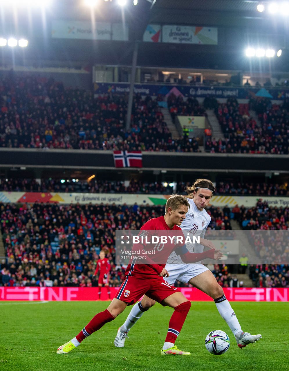 Martin Ødegaard of Norway and Roberts Uldrikis of Latvia