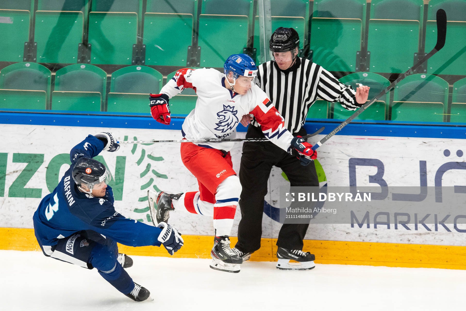 Lukas Pajer of Czech Republic skates in to a referee